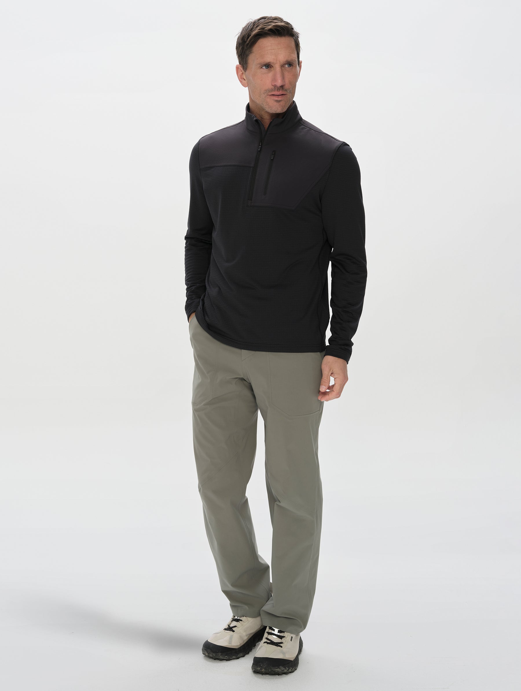 Front, full-body view of man wearing the Rocklin Half-Zip in Onyx Black from AETHER Apparel.