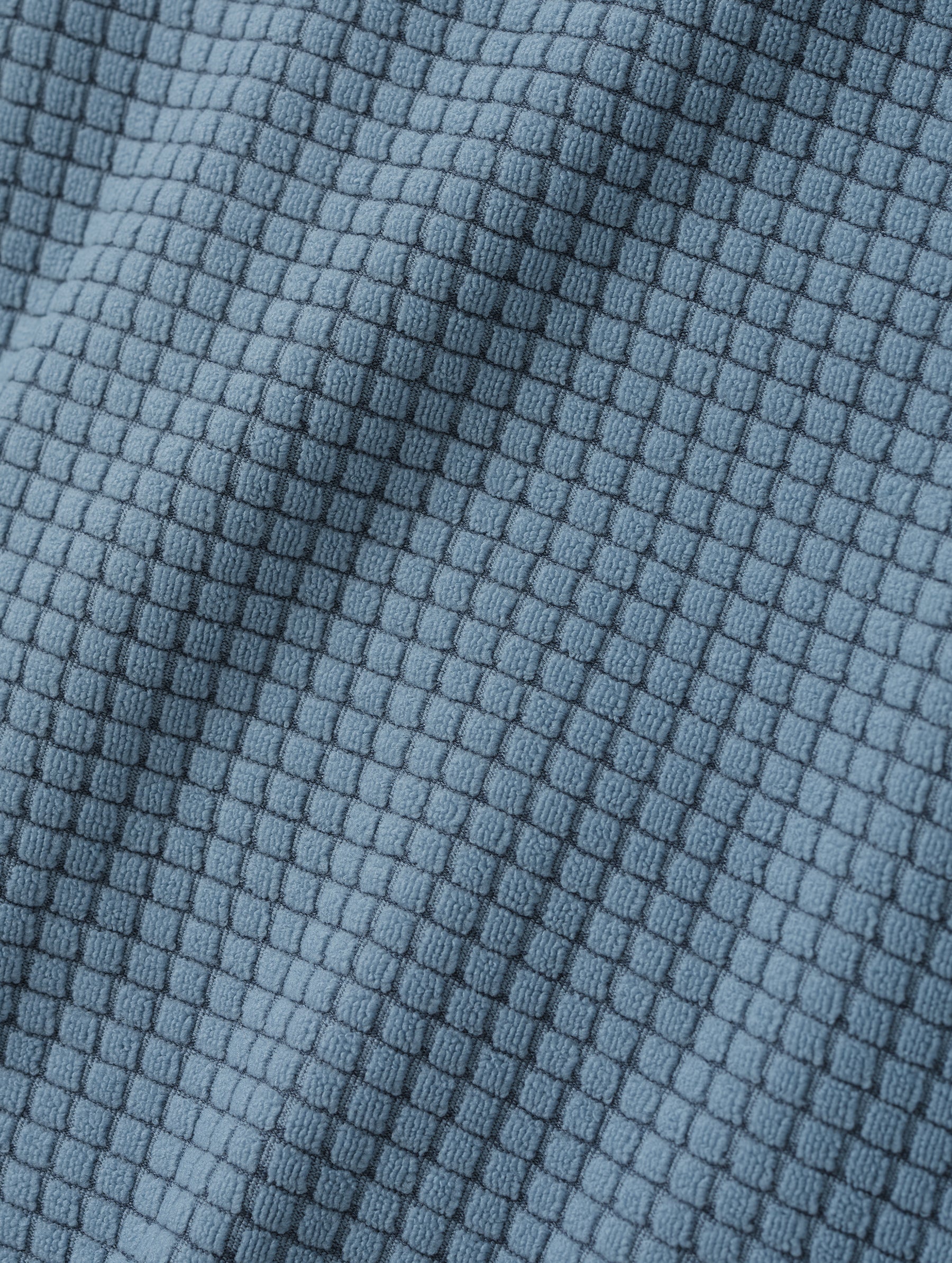 Closeup detailed view of the Check Knit soft fabric on the Rocklin Half-Zip in Portal Blue from AETHER Apparel.
