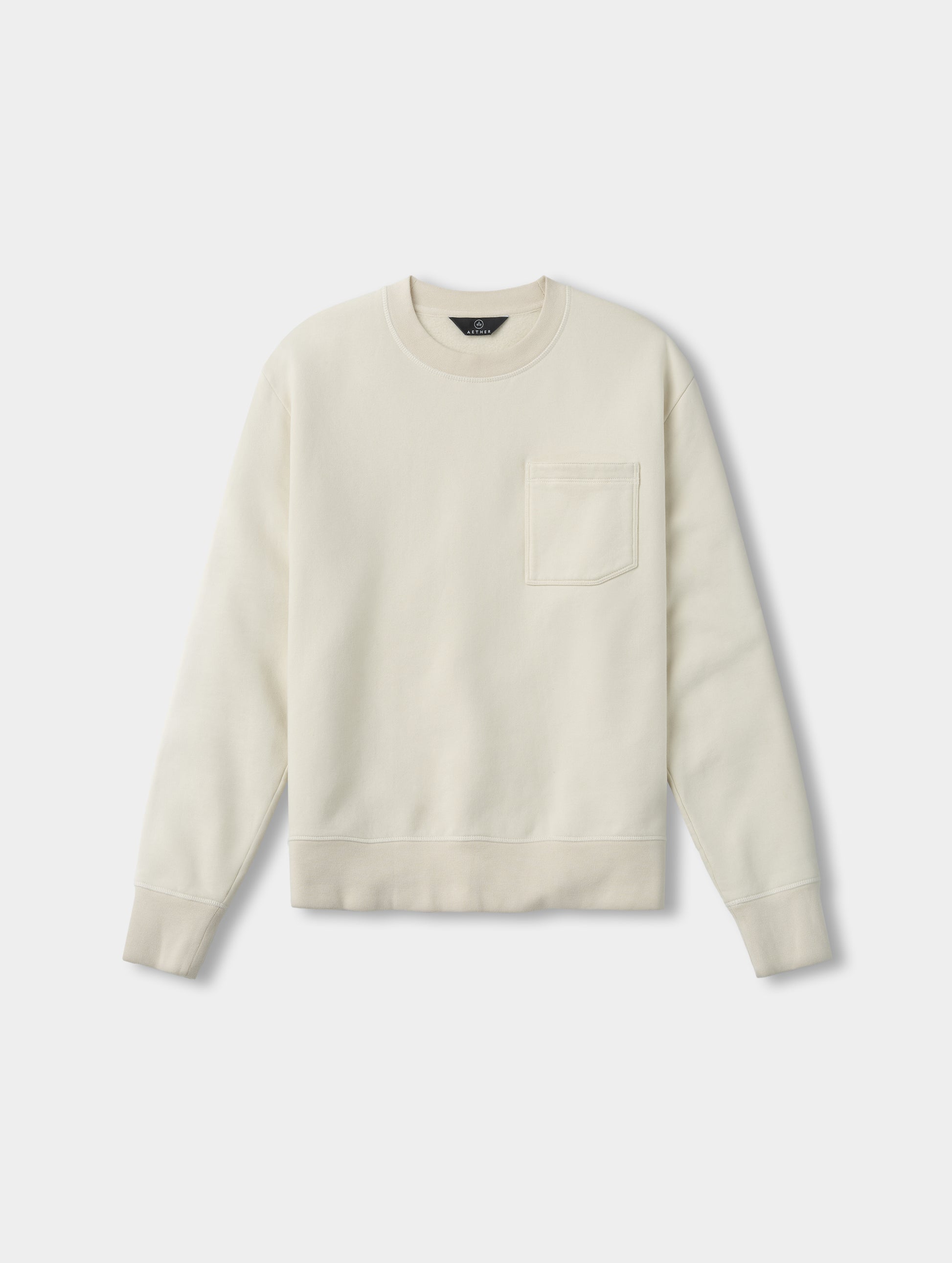 Flat lay view of the Rylan Crewneck Sweatshirt in Bone from AETHER Apparel.