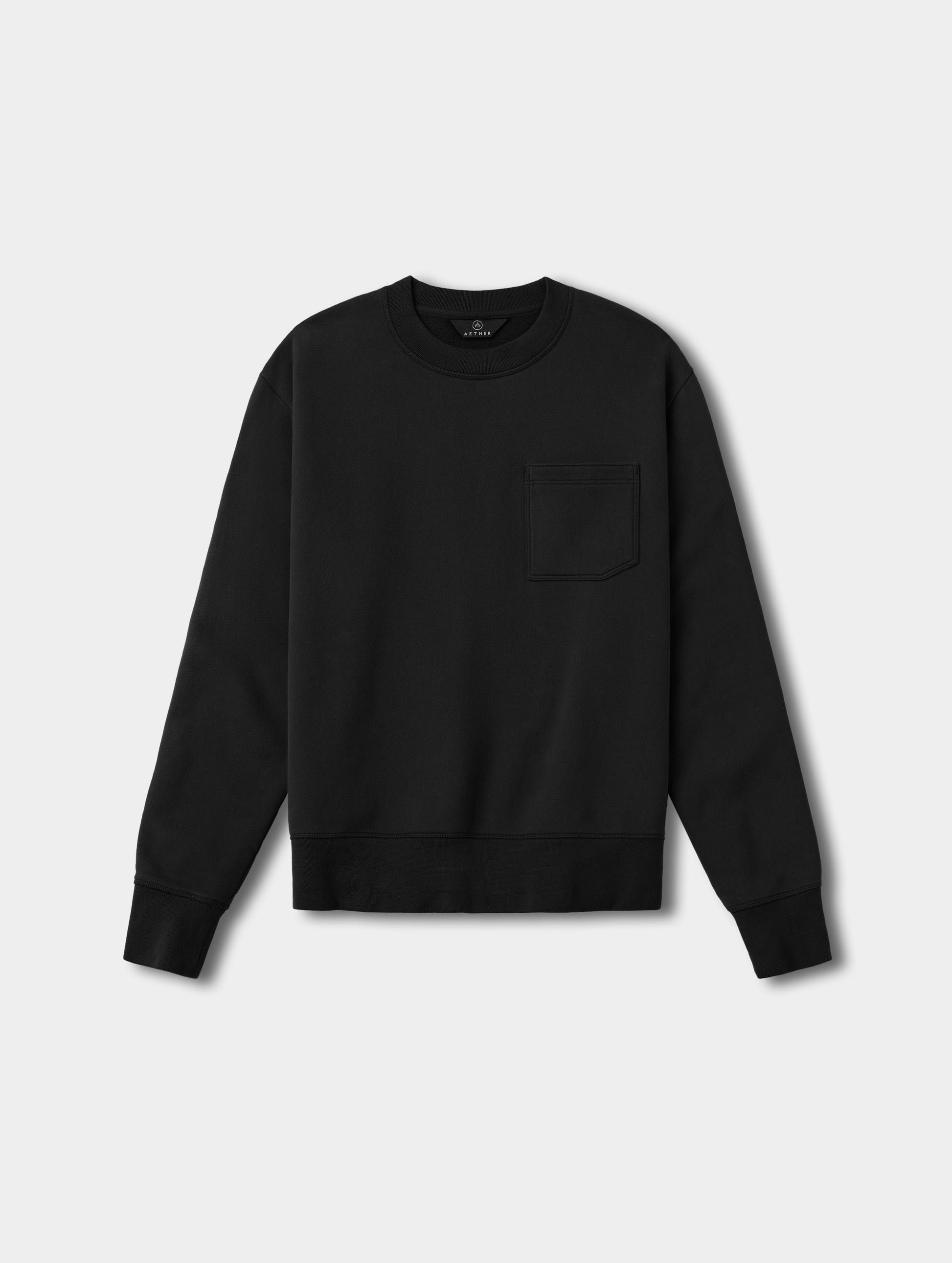 Flat lay view of the Rylan Crewneck Sweatshirt in Onyx Black from AETHER Apparel.