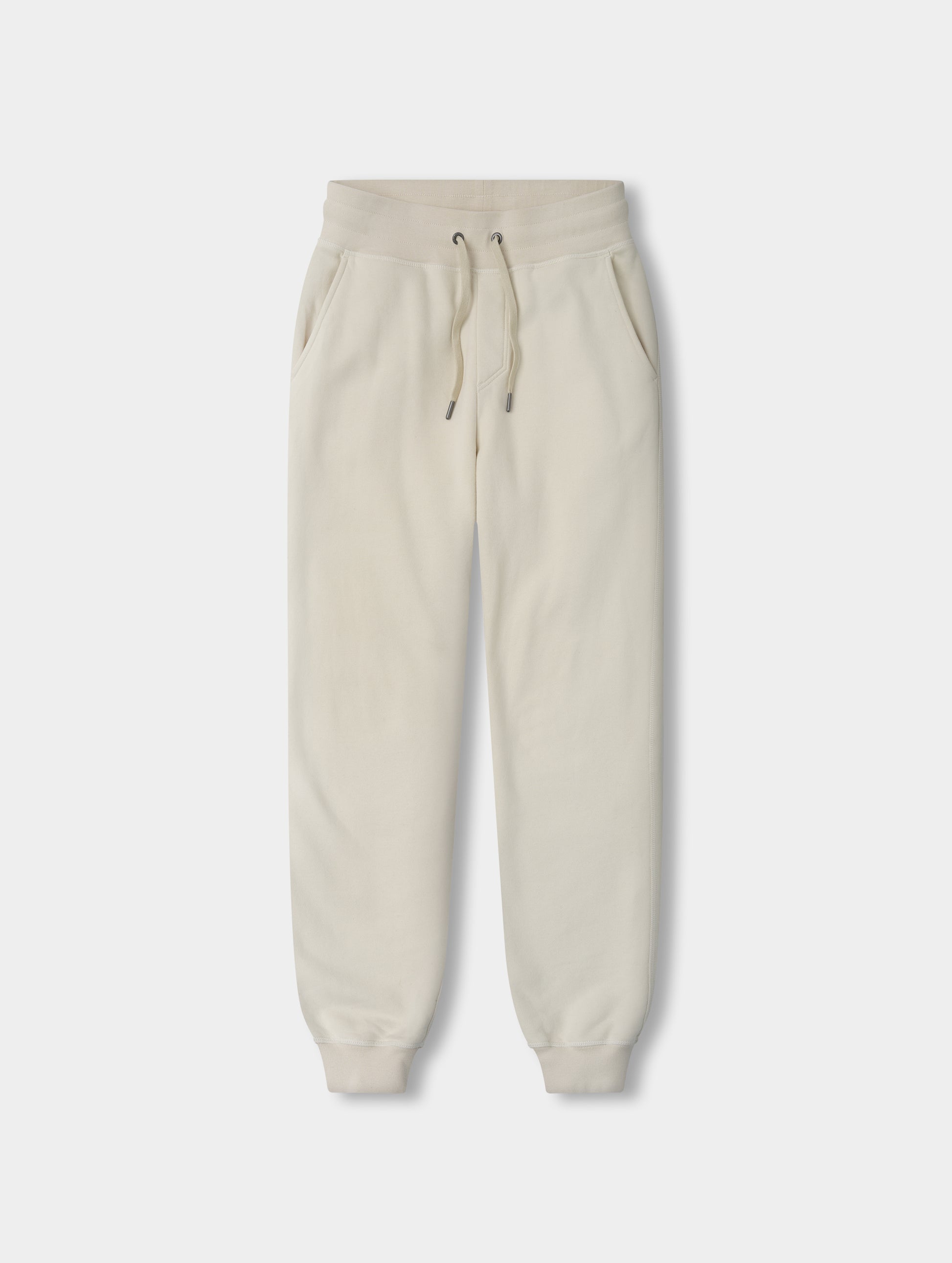 Flat lay view of the Rylan Cuffed Sweatpant in Bone from AETHER Apparel.