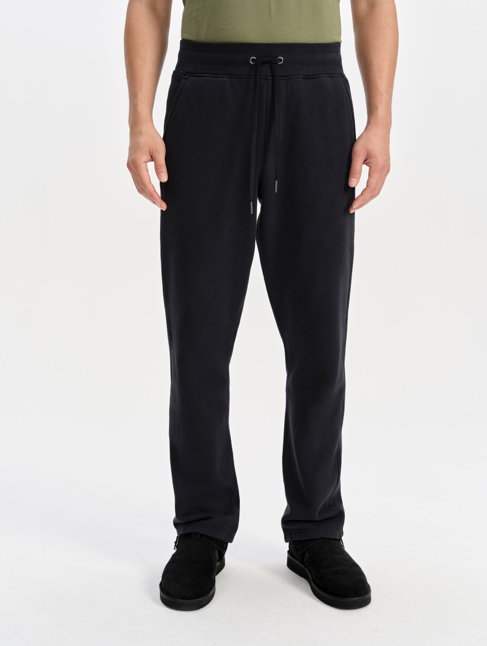 Front lower-body view of man wearing the Rylan Sweat Pant in Onyx Black from AETHER Apparel. 