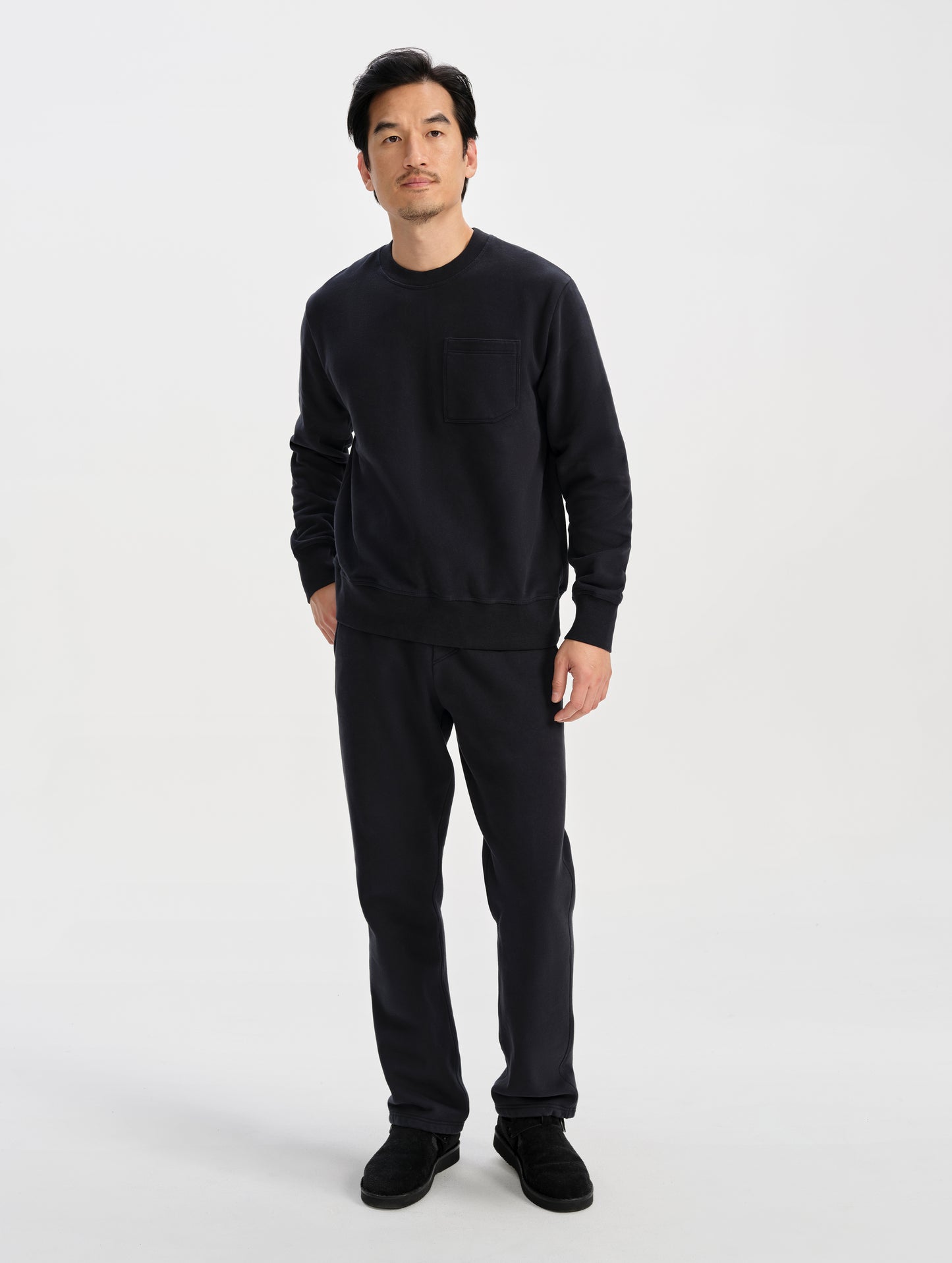 Front full-body view of man wearing the Rylan Sweat Pant in Onyx Black from AETHER Apparel. 