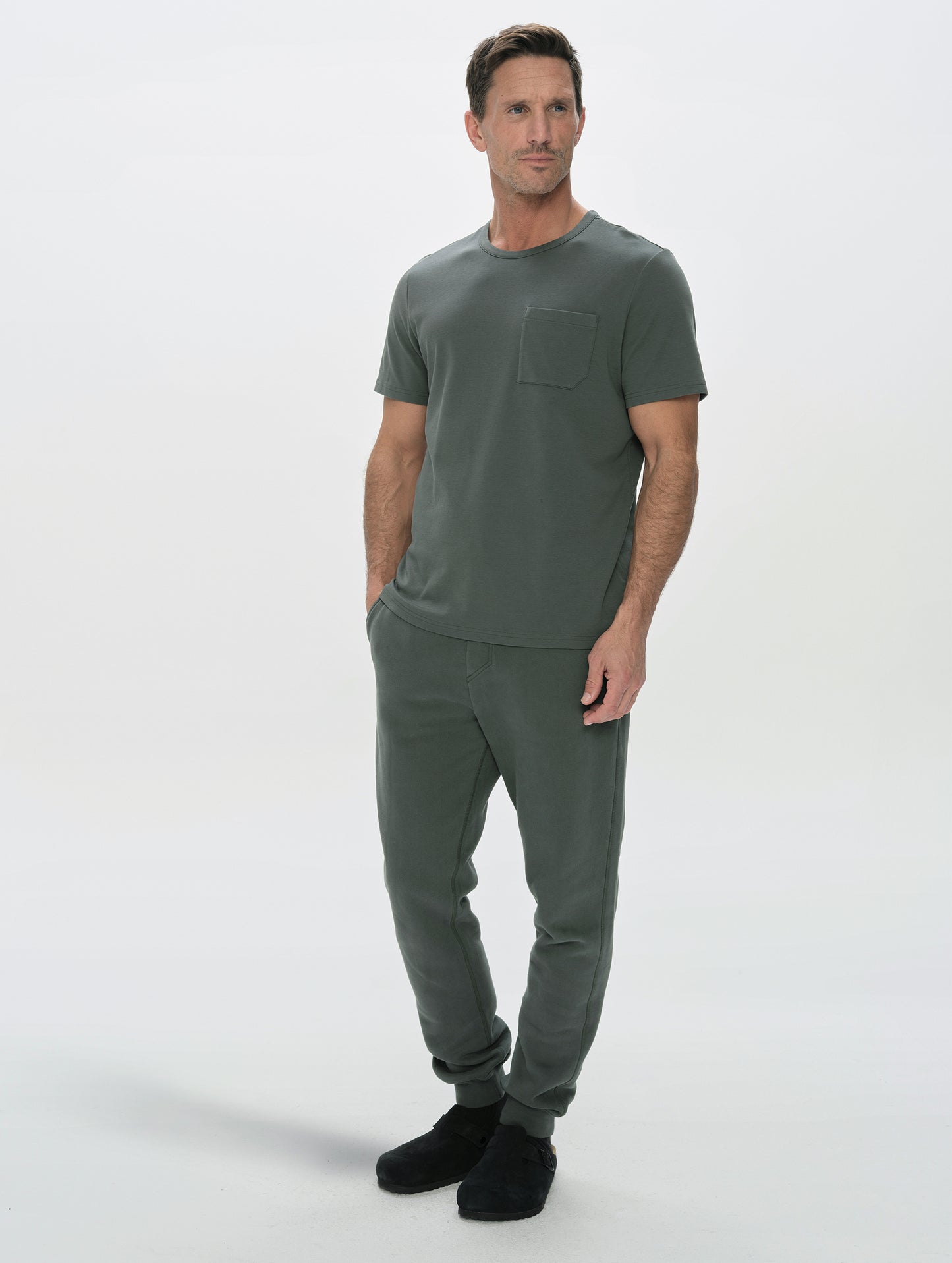 Front, full-body view of man wearing the Rylan Cuffed Sweatpant in Saville Green  from AETHER Apparel.