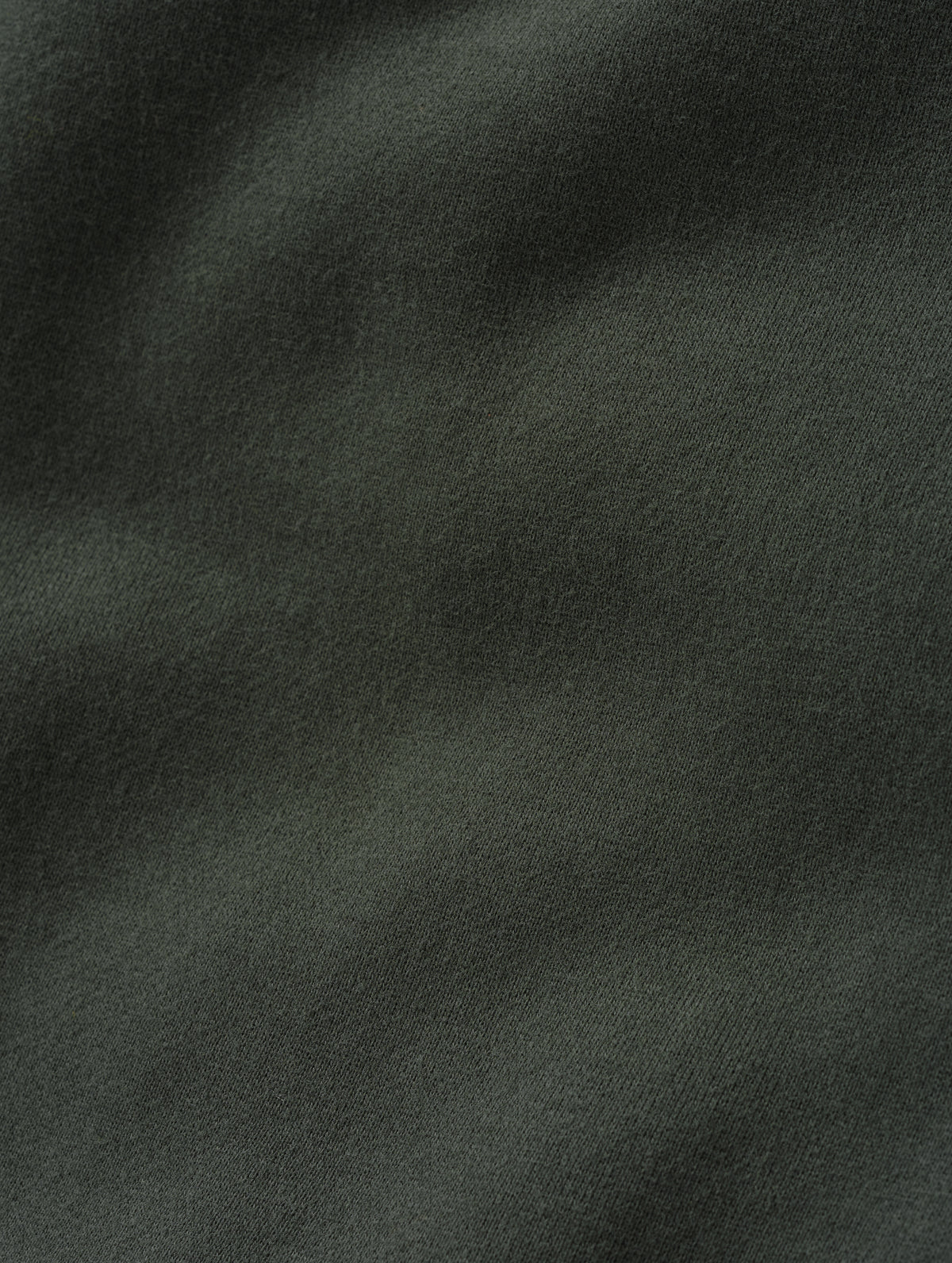 Closeup detailed view of the ultra-soft carbon brushed fleece cotton on the Rylan Sweat Pant in Saville Green from AETHER Apparel. 
