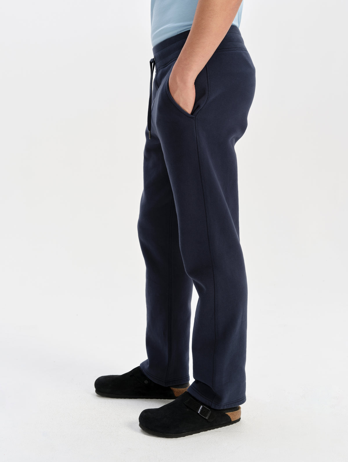 Side profile lower-body view of man wearing the Rylan Sweat Pant in Total Eclipse from AETHER Apparel. 