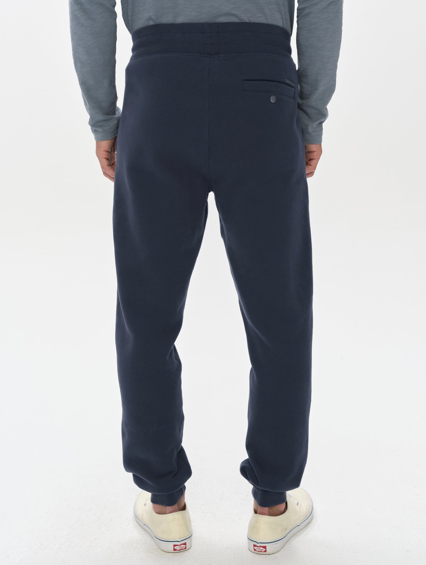 Rear, lower-body view of man wearing the Rylan Cuffed Sweatpant in Total Eclipse from AETHER Apparel.