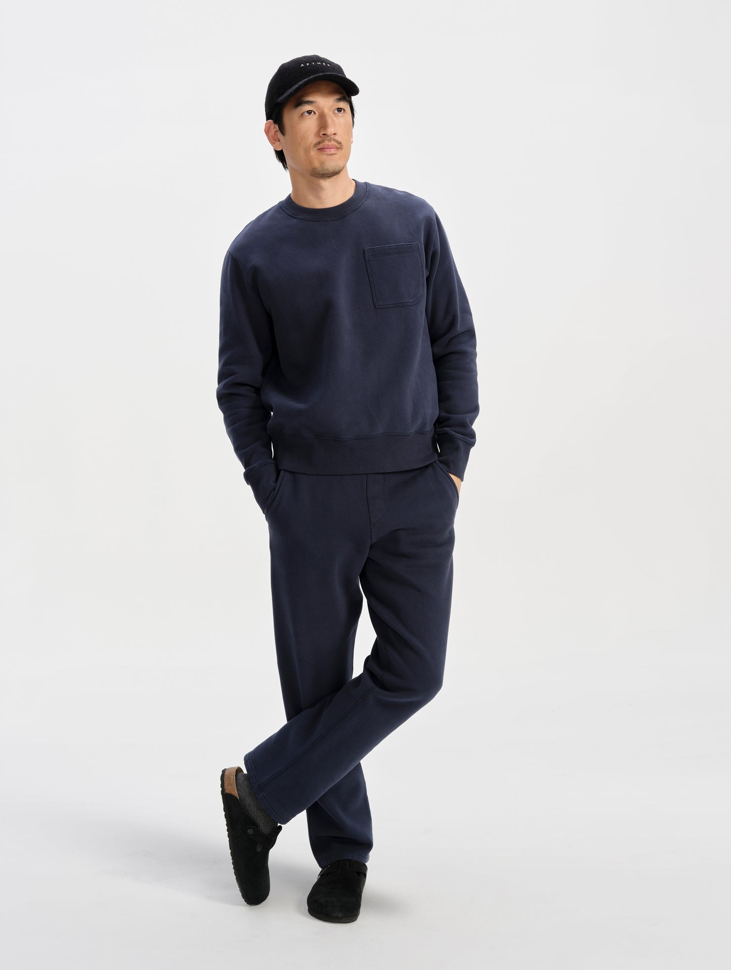 Front full-body view of man wearing the Rylan Sweat Pant in Total Eclipse from AETHER Apparel. 