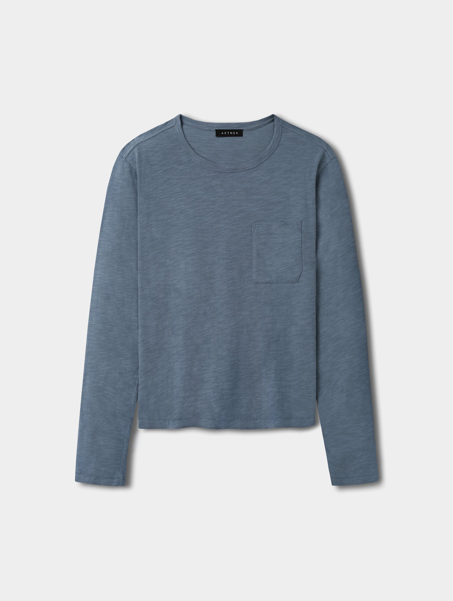 Flat lay view of the Slub Pocket Long-Sleeve Tee 2.0 in Portal Blue from AETHER Apparel.