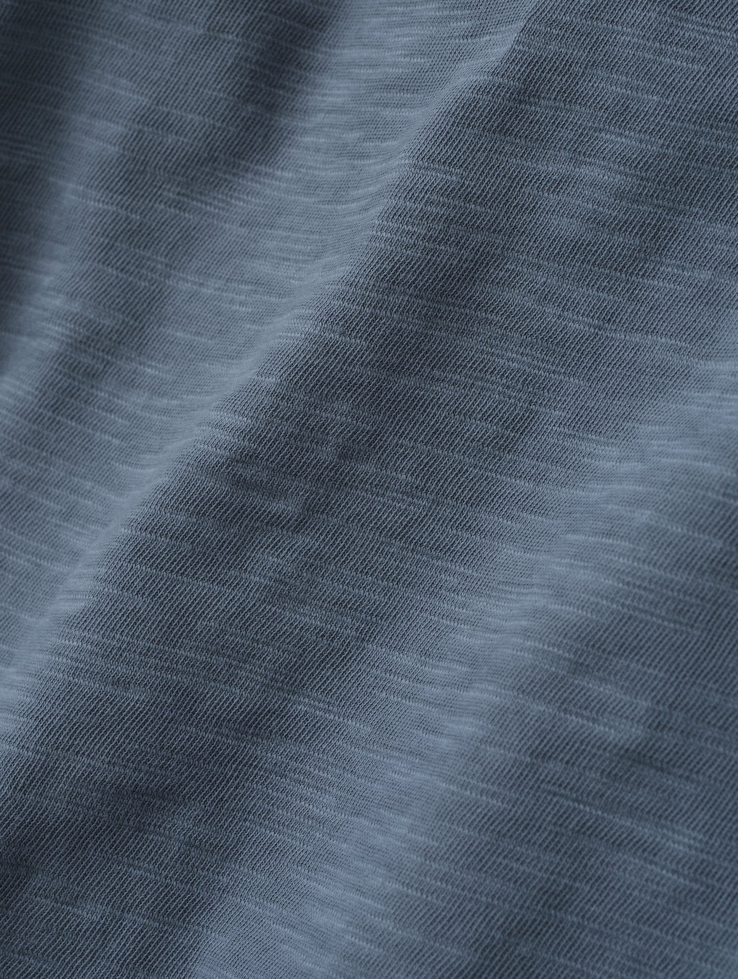 Closeup detailed view of the fabric on the Slub Pocket Long-Sleeve Tee 2.0 in Portal Blue from AETHER Apparel.