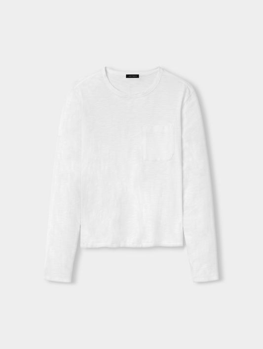 Front, full-body view of man wearing Slub Long-Sleeve Pocket Tee 2.0 in White from AETHER Apparel.