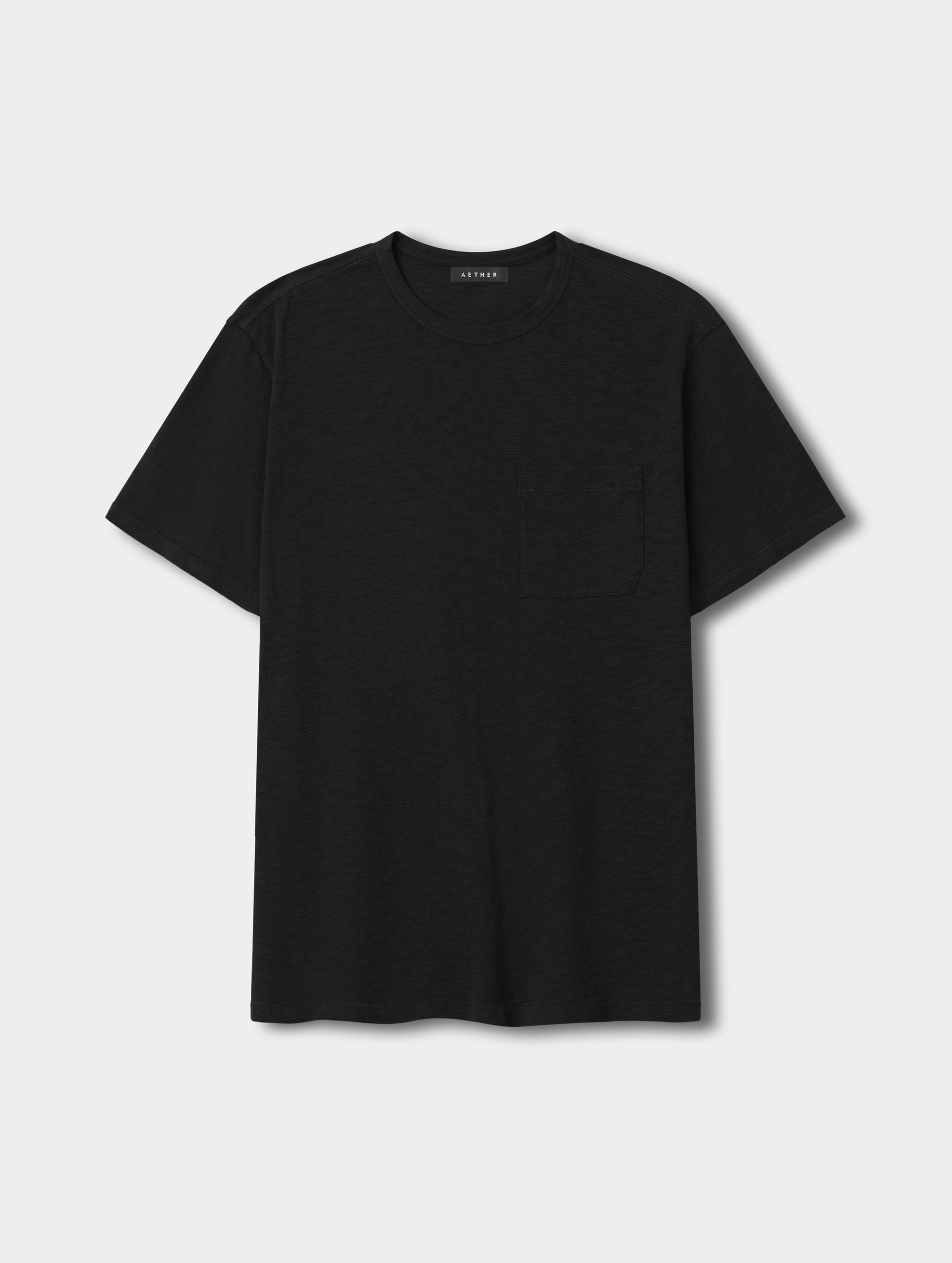 Flat lay view of the Slub Pocket Tee 2.0 in Onyx Black from AETHER Apparel.