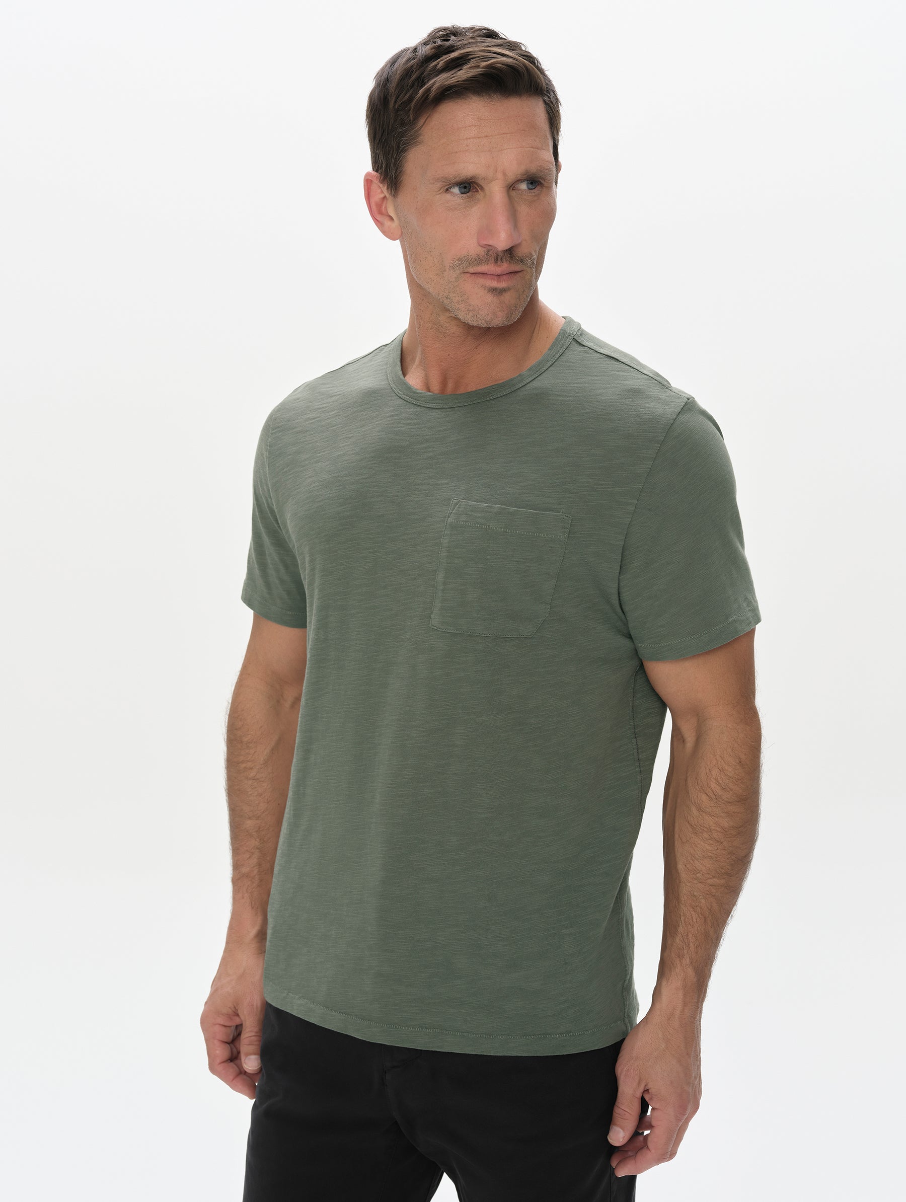 Front, upper-body view of man wearing the Slub Pocket Tee 2.0 in Gunmetal from AETHER Apparel.