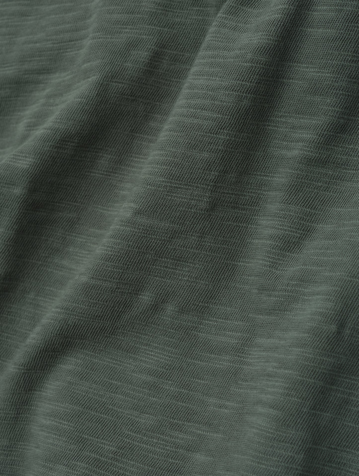 Closeup detailed view of the fabric on the Slub Pocket Tee 2.0 in Gunmetal from AETHER Apparel.