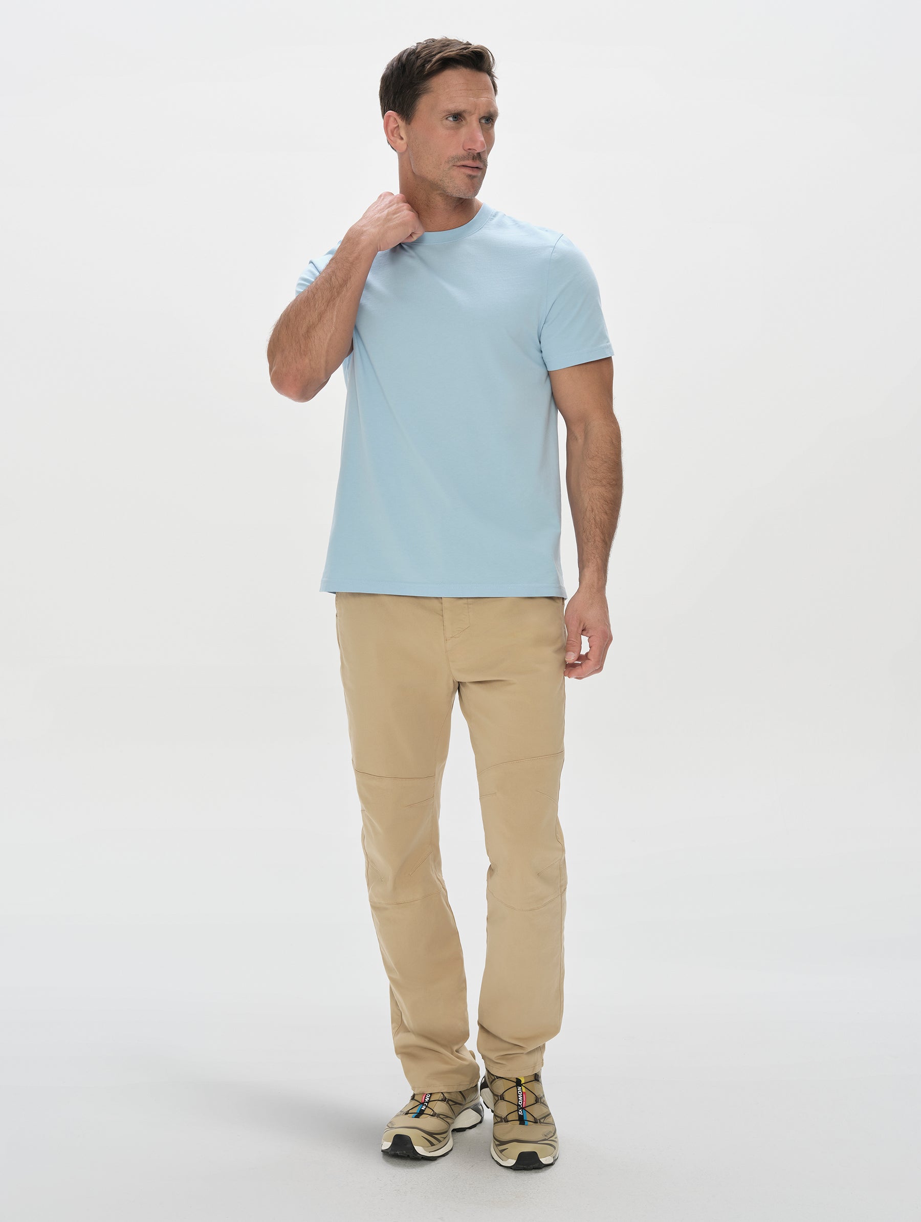 Front, full-body view of man wearing the Standard Tee in Cloud Blue from AETHER Apparel.