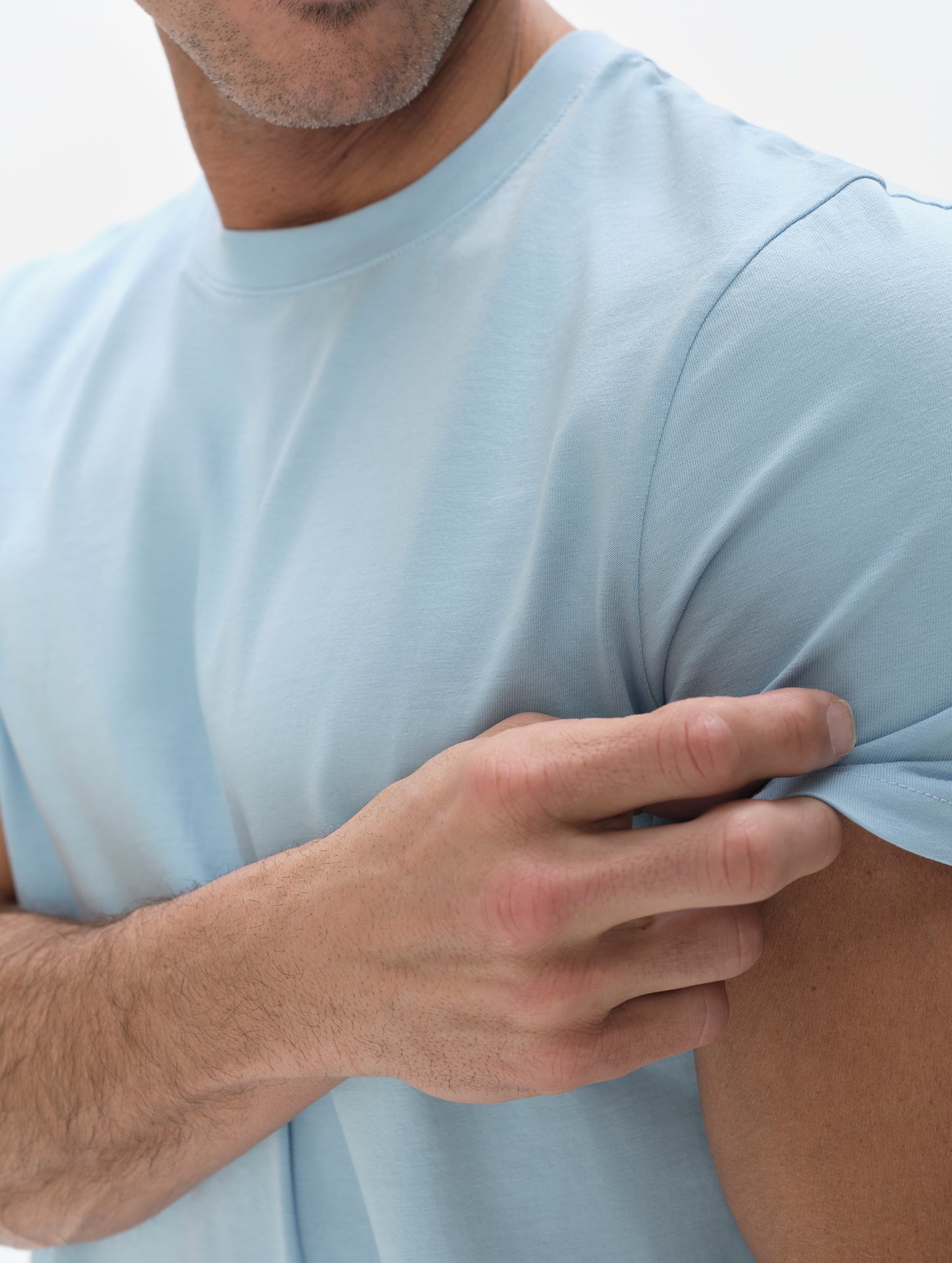 Closeup detailed view of the shoulder on the Standard Tee in Cloud Blue from AETHER Apparel.