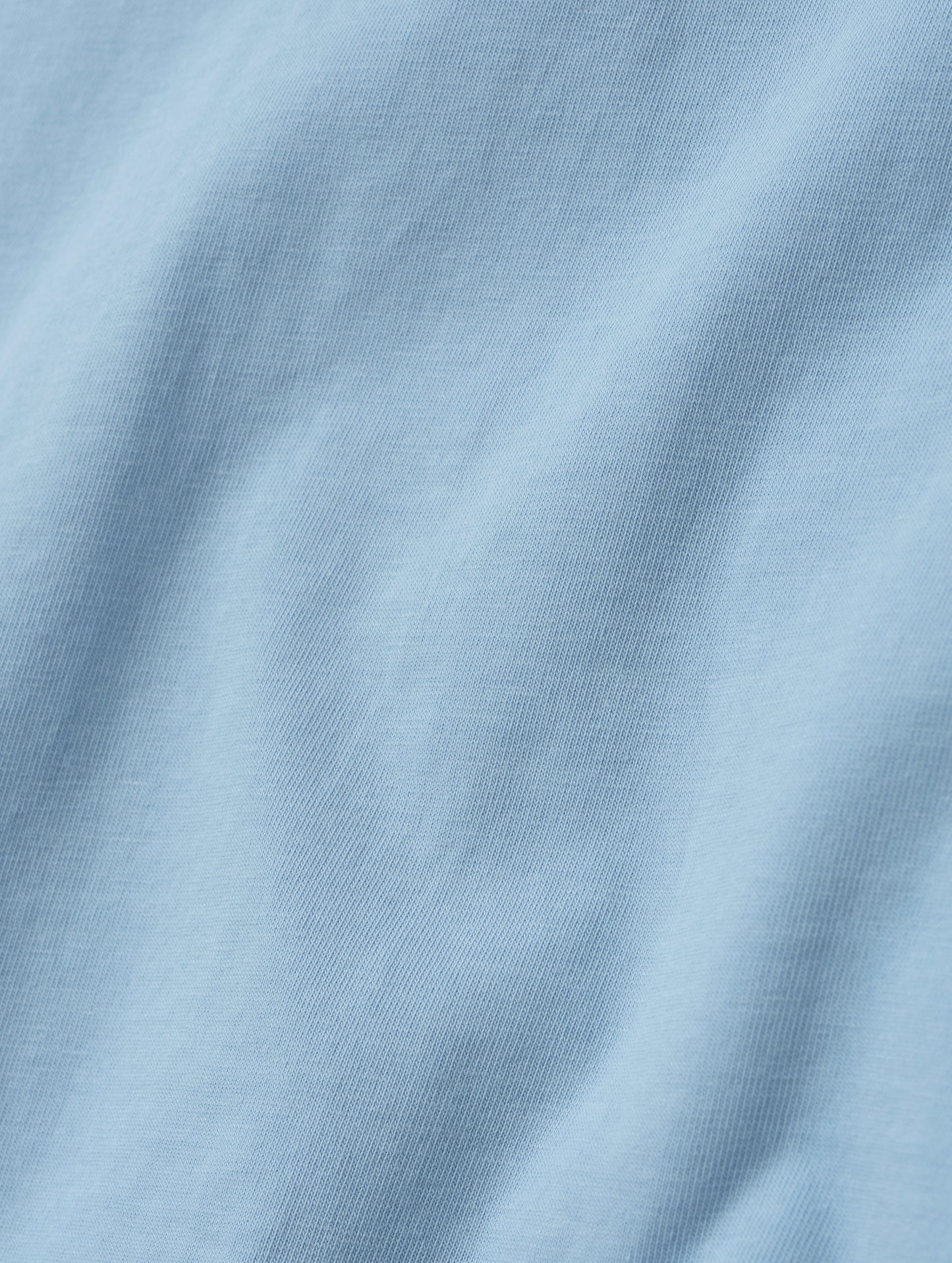 Closeup detailed view of the fabric on the Standard Tee in Cloud Blue from AETHER Apparel.