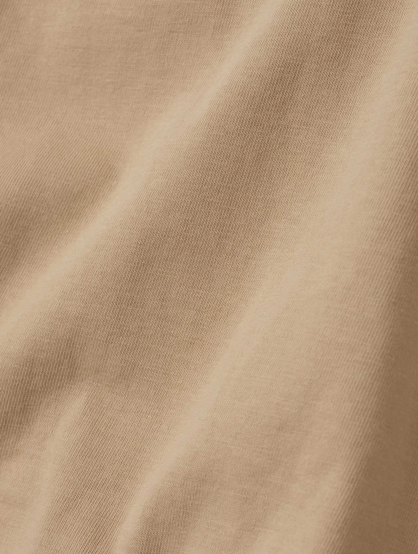 Closeup detailed view of the fabric on the Standard Tee in Desert Tan from AETHER Apparel.