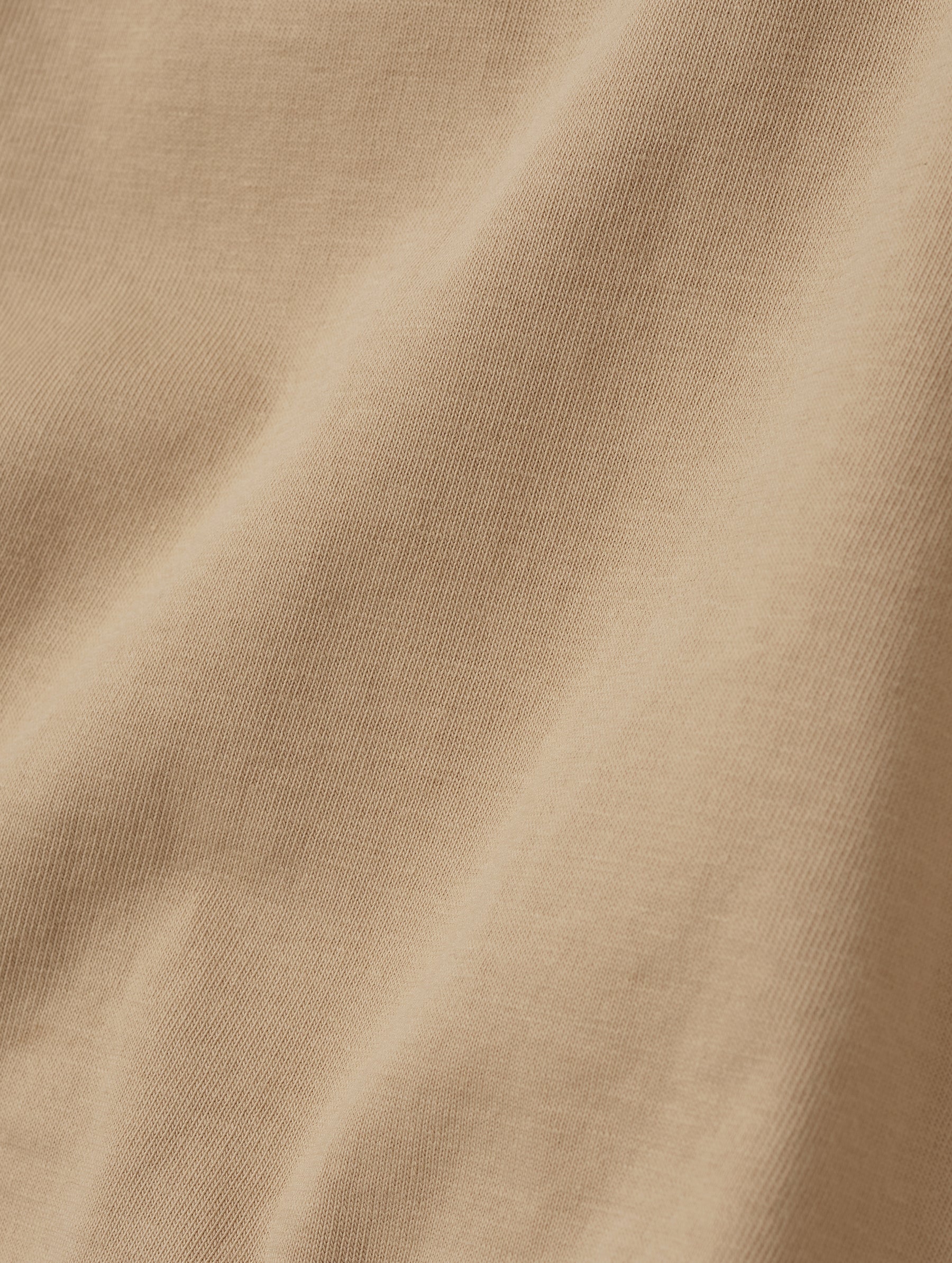 Closeup detailed view of the fabric on the Standard Tee in Desert Tan from AETHER Apparel.