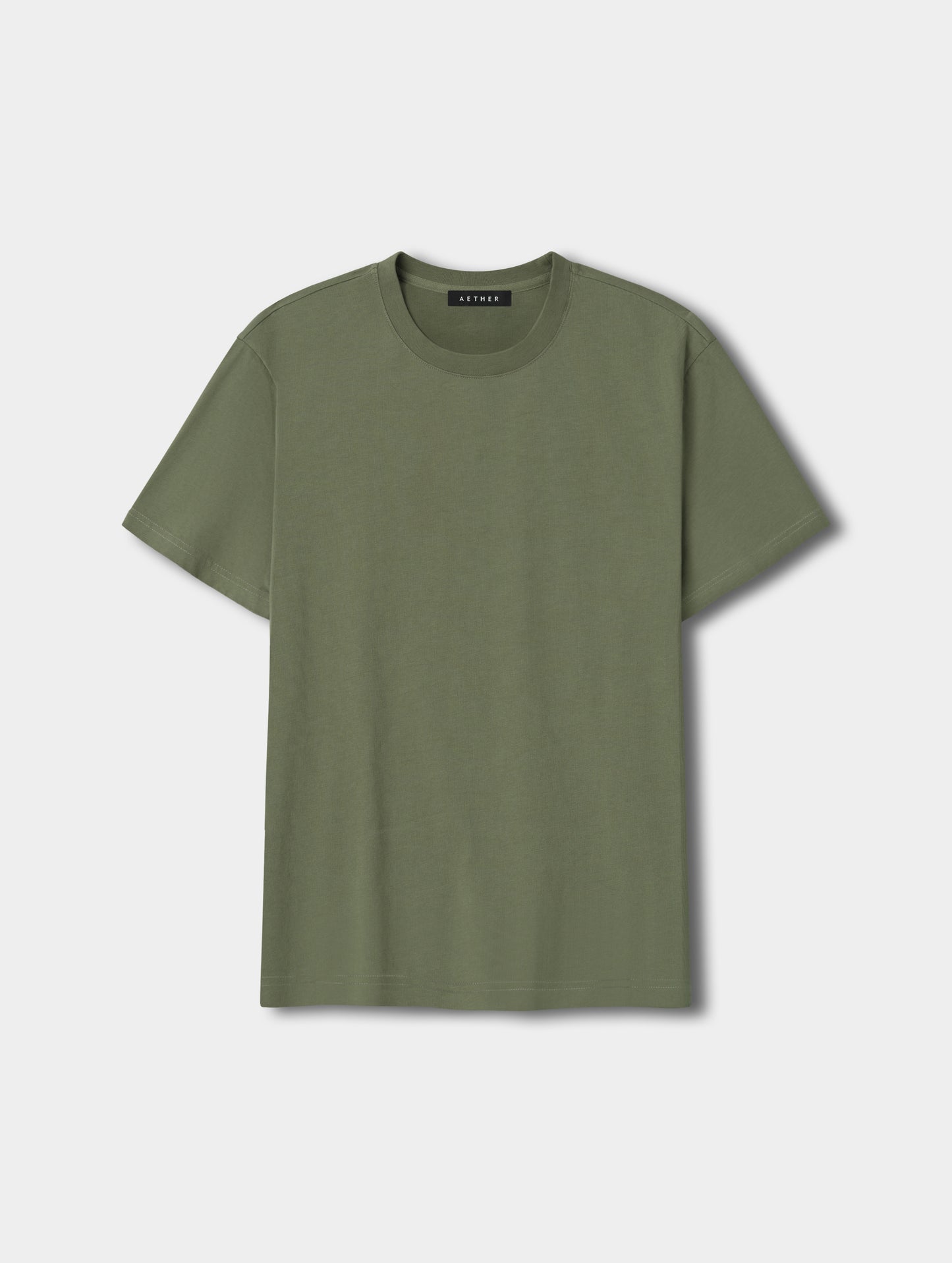 Flat lay view of the Standard Tee in Fern Green from AETHER Apparel.