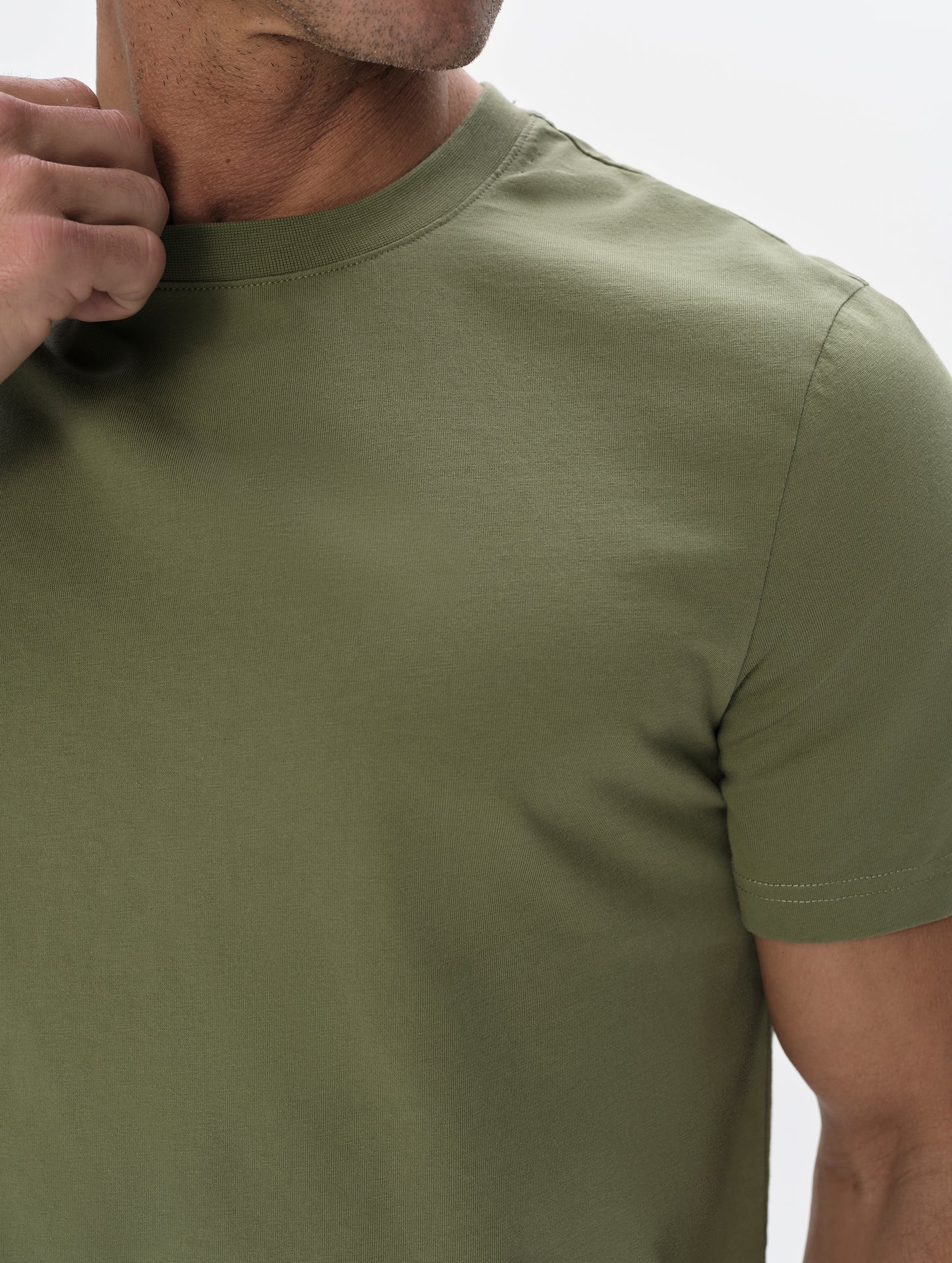 Closeup detailed view of the shoulder on the Standard Tee in Fern Green from AETHER Apparel.
