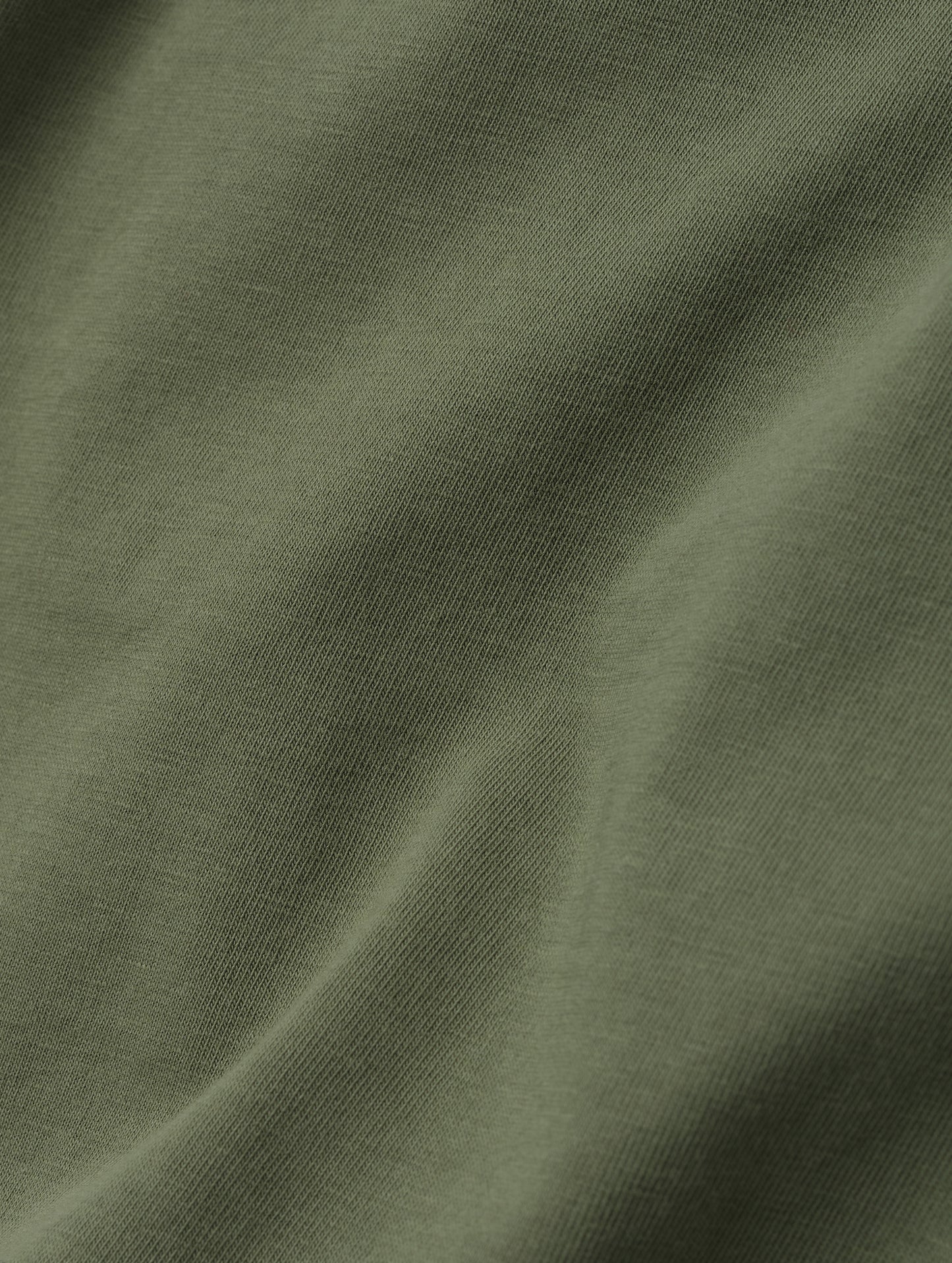 Closeup detailed view of the fabric on the Standard Tee in Fern Green from AETHER Apparel.