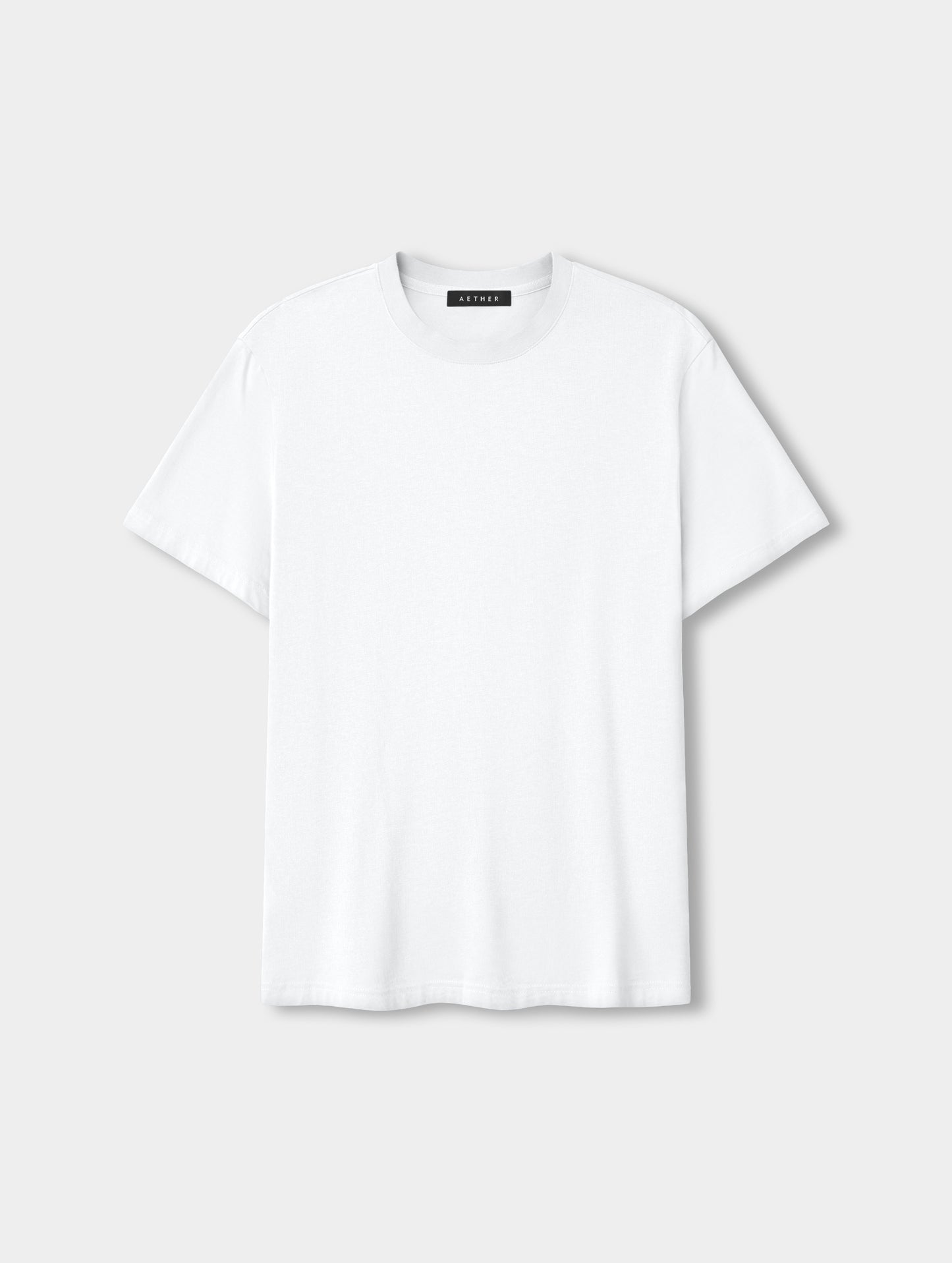 Flat lay view of the Standard Tee in White from AETHER Apparel.