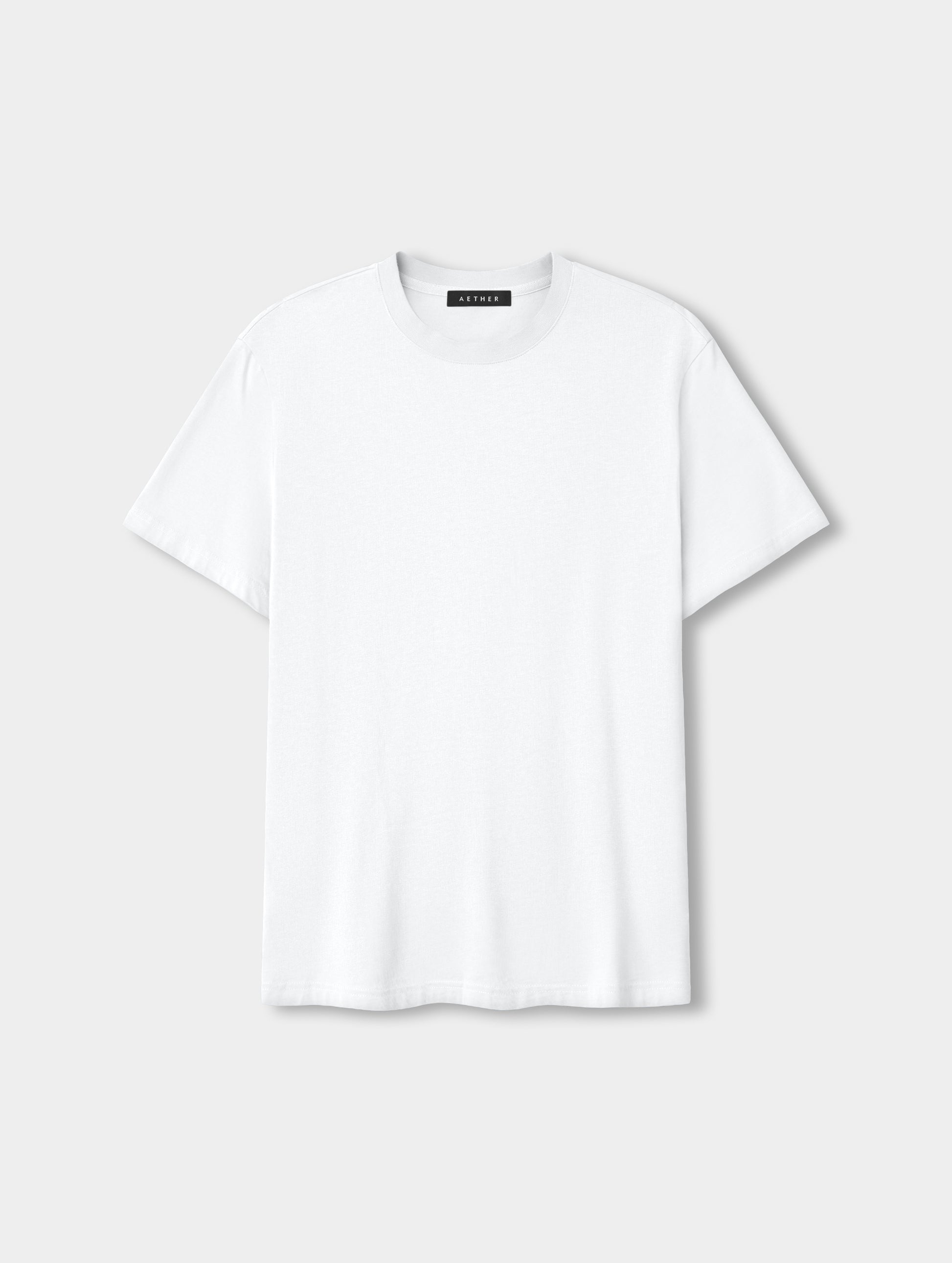 Flat lay view of the Standard Tee in White from AETHER Apparel.