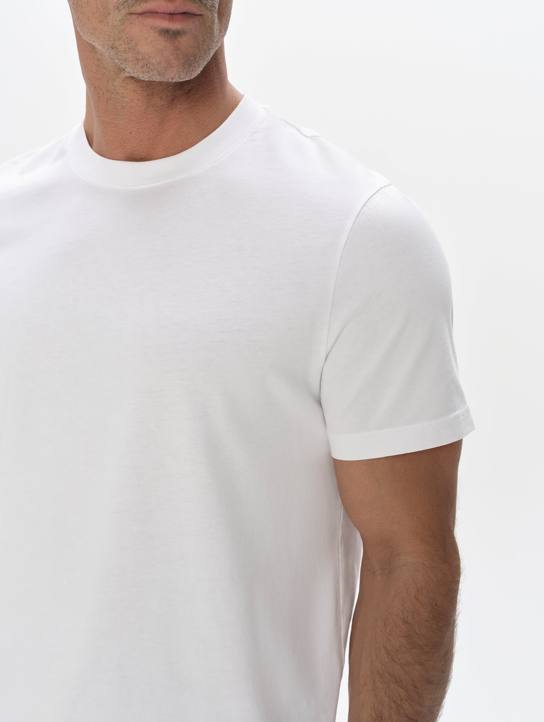 Closeup detailed view of the shoulder on the Standard Tee in White from AETHER Apparel.