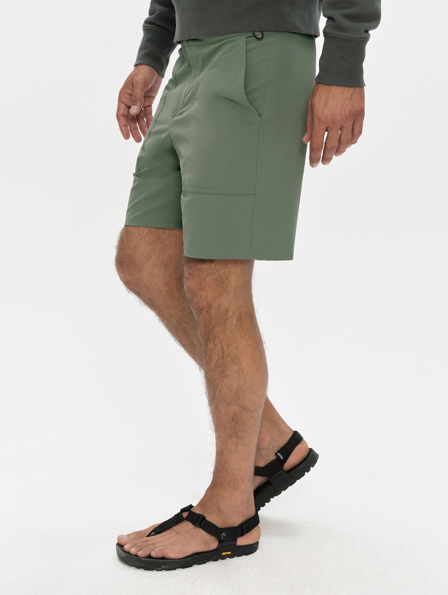 Front, 3/4, lower-body view of man wearing the Velo Short in Gunmetal from AETHER Apparel.