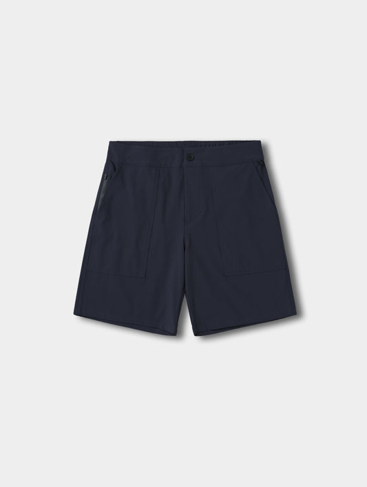 Flat lay view of the Velo Short in Total Eclipse dark blue from AETHER Apparel.