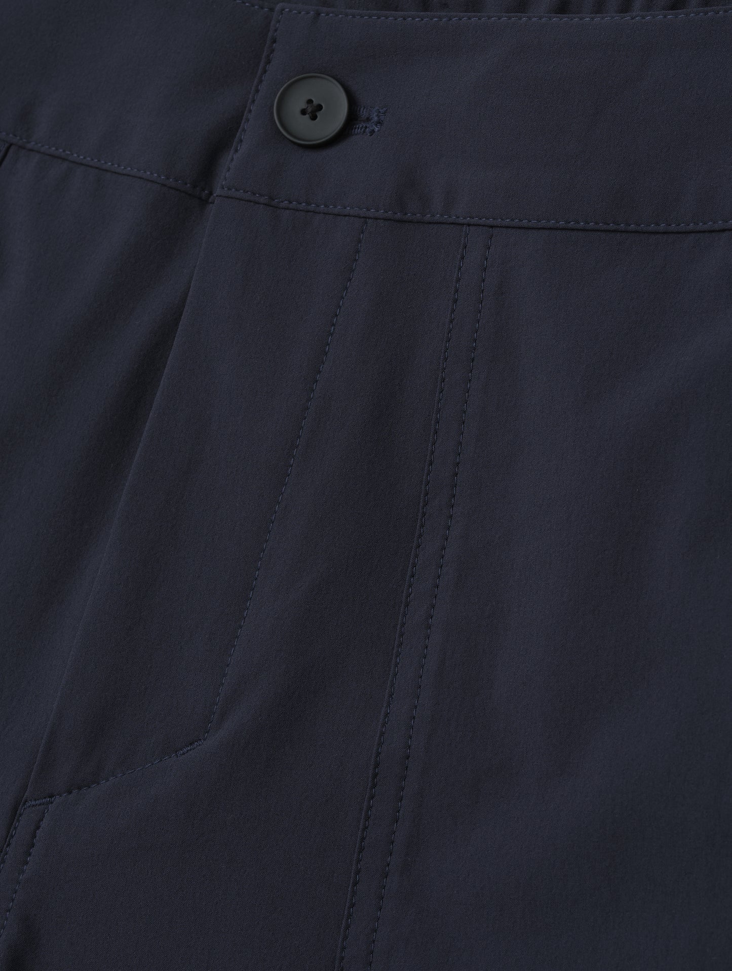 Closeup detailed view of main front closure on the Velo Short in Total Eclipse dark blue from AETHER Apparel.