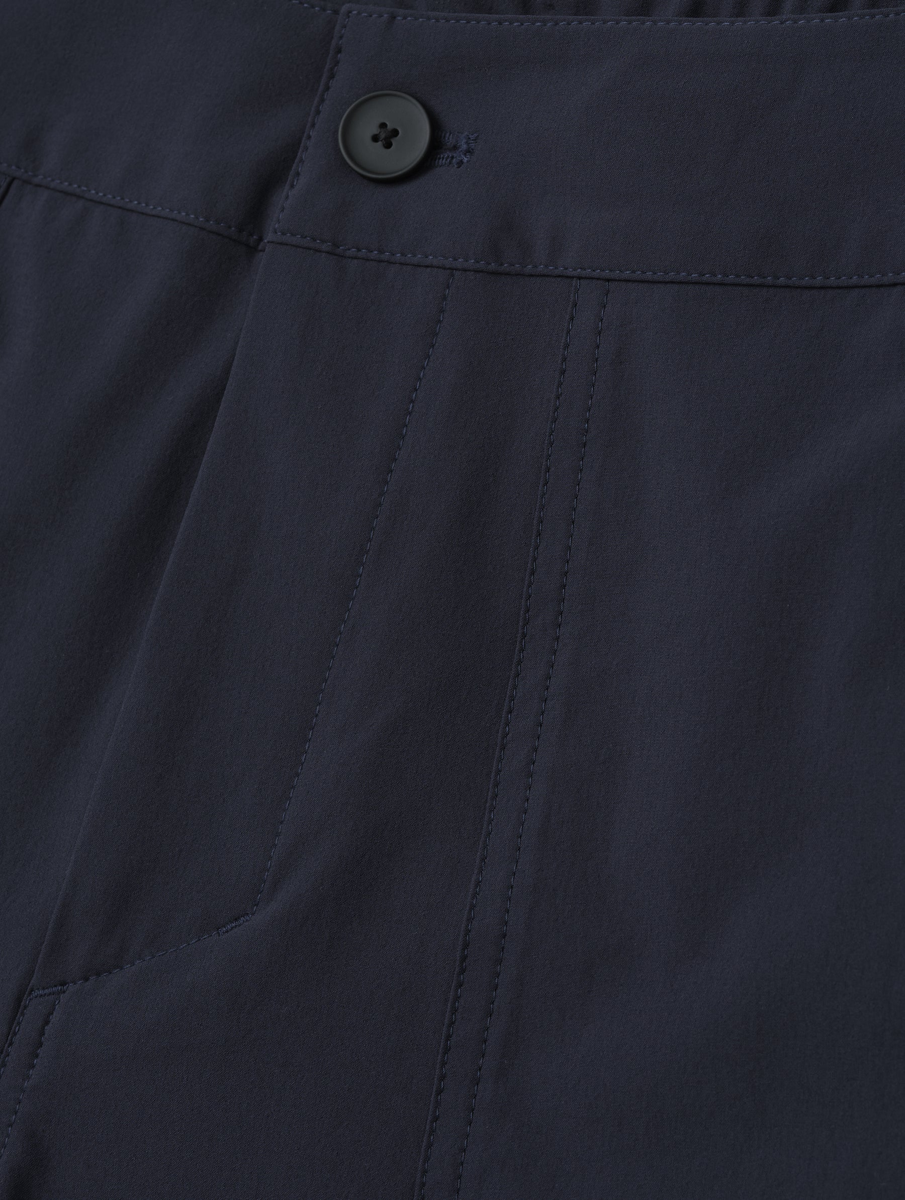 Closeup detailed view of main front closure on the Velo Short in Total Eclipse dark blue from AETHER Apparel.