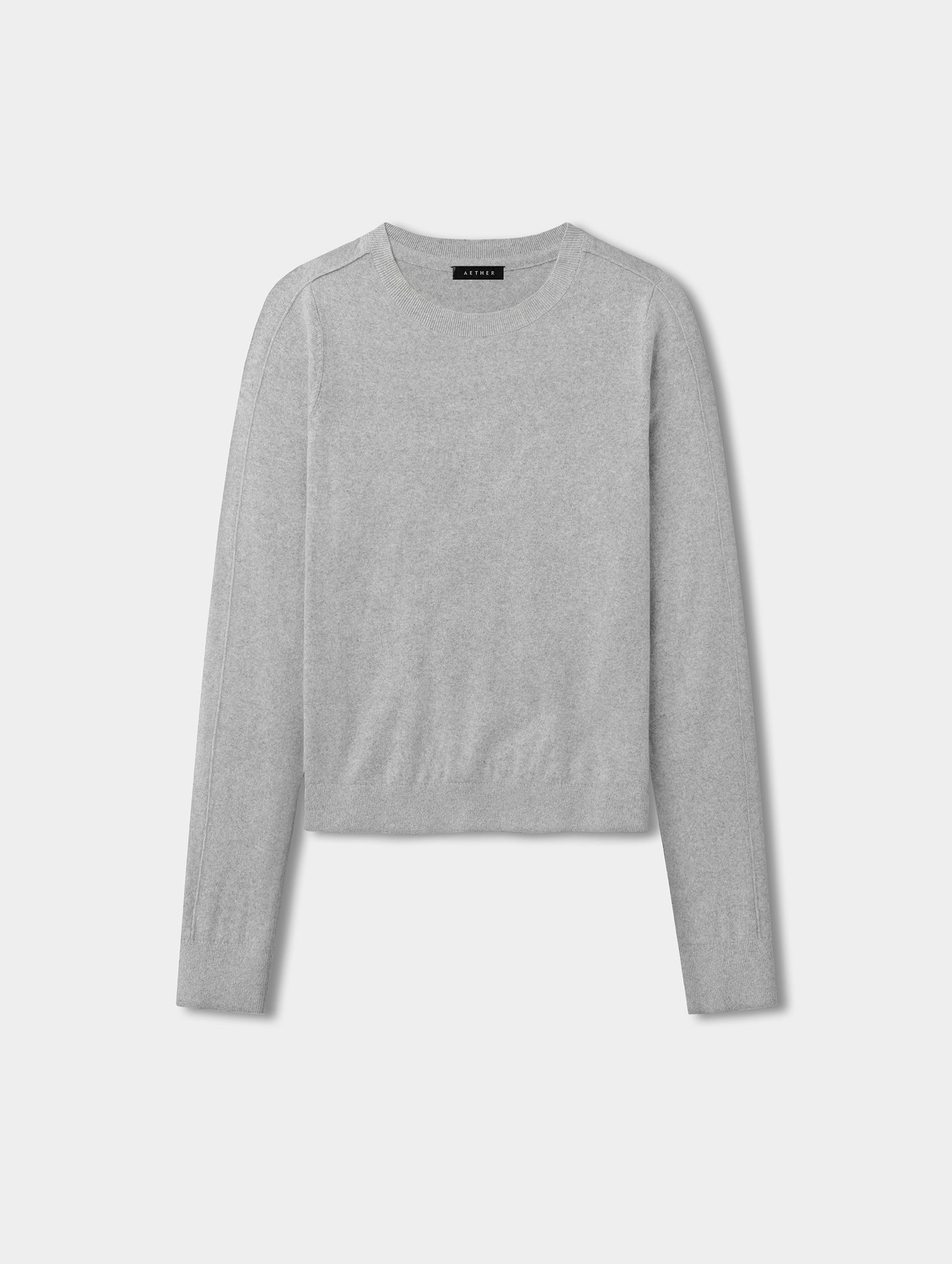 Flat lay view of the women’s Aero Crewneck Sweater 2.0 in Alumino Grey from AETHER Apparel.