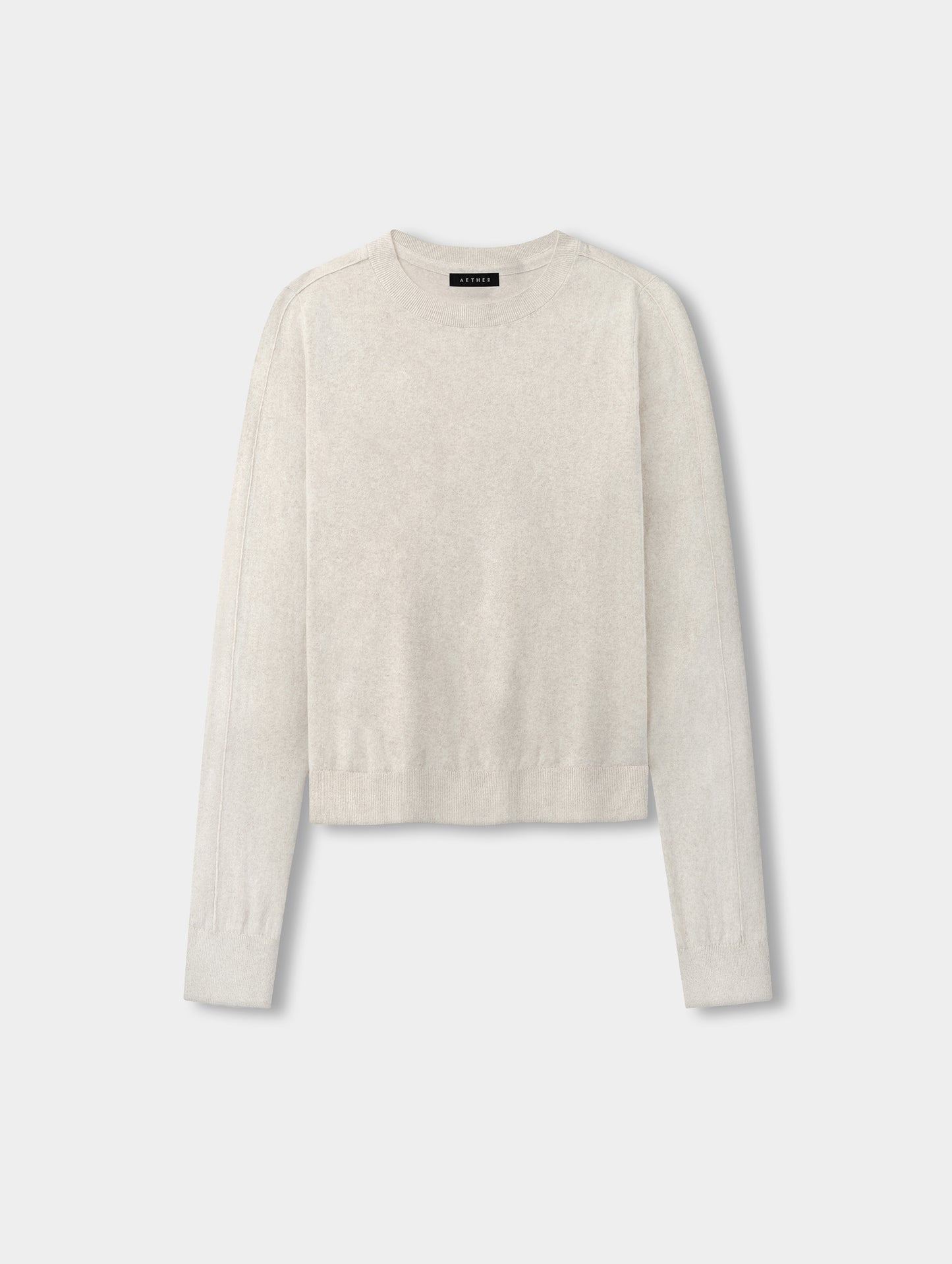Flat lay view of the women’s Aero Crewneck Sweater 2.0 in Lino Tan from AETHER Apparel.