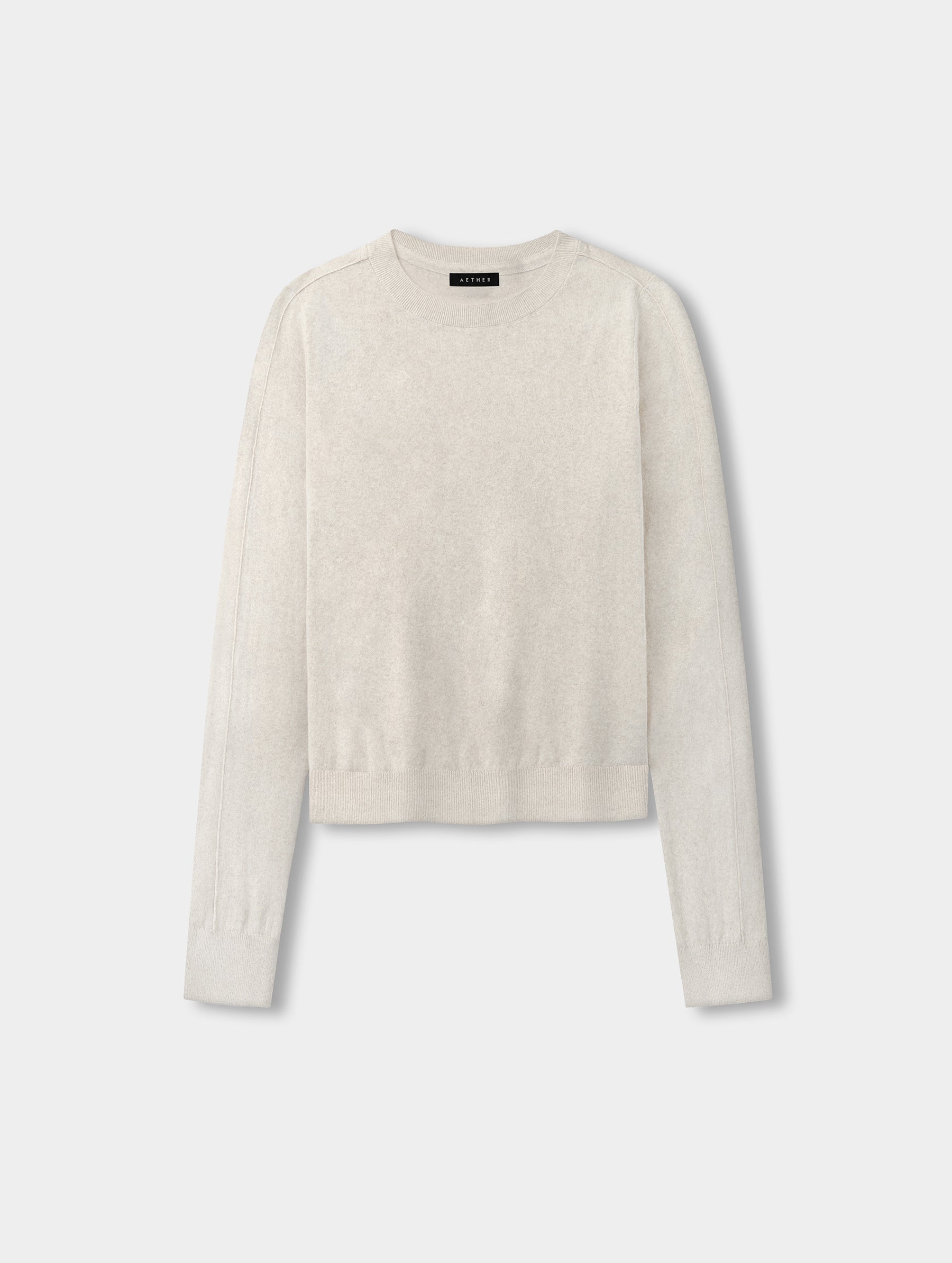 Flat lay view of the women’s Aero Crewneck Sweater 2.0 in Lino Tan from AETHER Apparel.