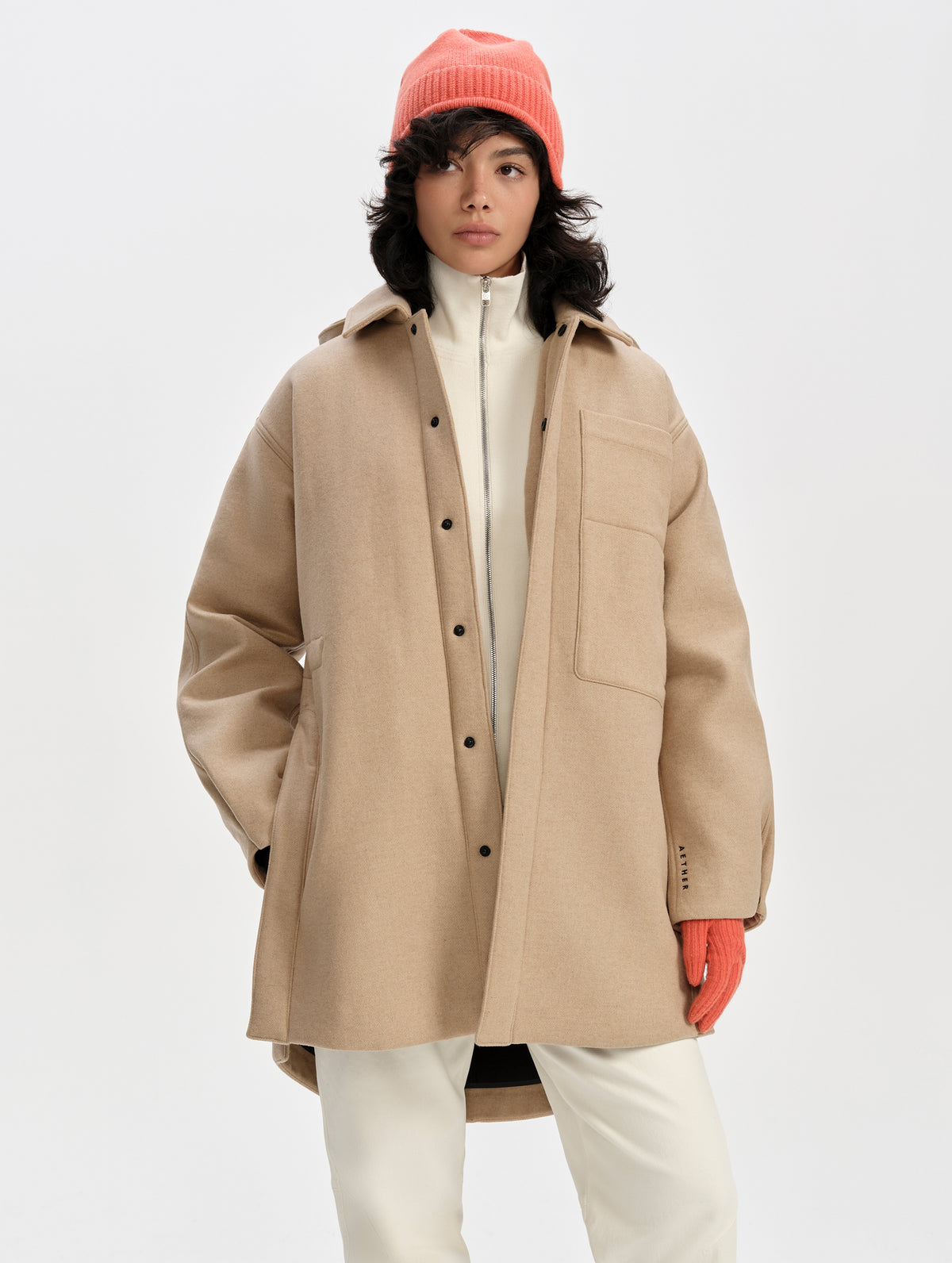 Front upper-body view of woman wearing Affina Wool 3-in-1 Overcoat in Latte Brown from AETHER Apparel.