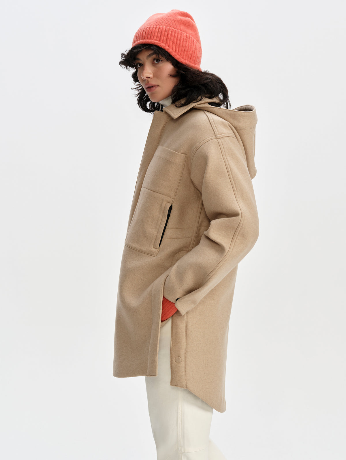 Side profile upper-body view of woman wearing Affina Wool 3-in-1 Overcoat in Latte Brown from AETHER Apparel.
