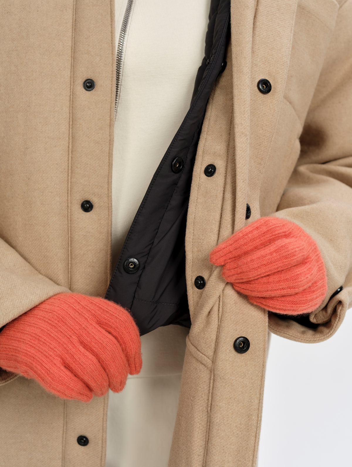 Closeup detailed view of the Lock-In Layering System that attaches the removable insulated thermal liner to the Affina Wool 3-in-1 Overcoat in Latte Brown from AETHER Apparel.