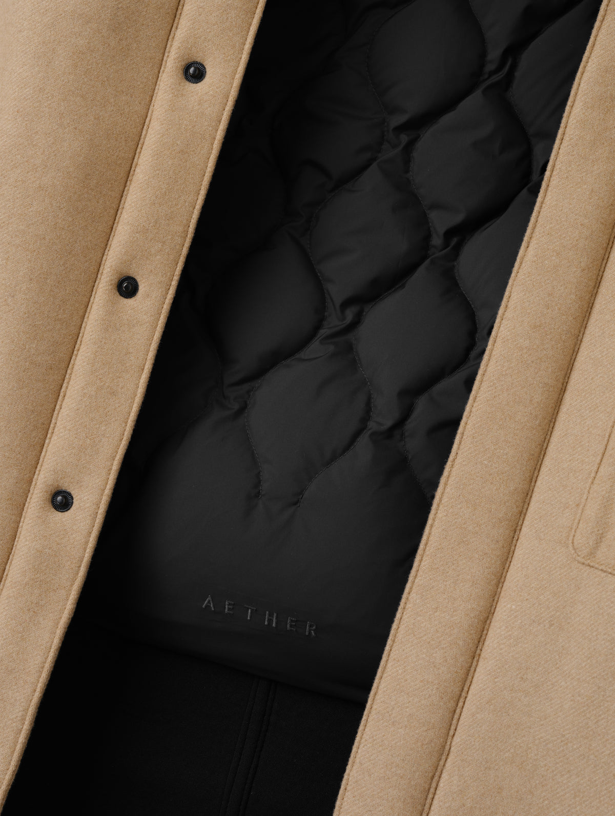 Closeup detailed view of the removable insulated thermal liner on the Affina Wool 3-in-1 Overcoat in Latte Brown from AETHER Apparel.