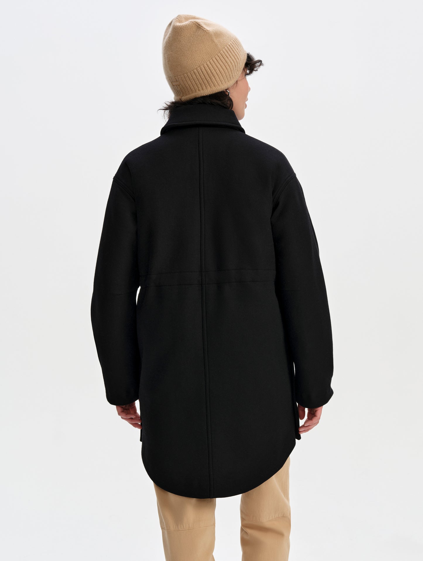 Rear upper-body view of woman wearing Affina Wool 3-in-1 Overcoat in Onyx Black from AETHER Apparel.
