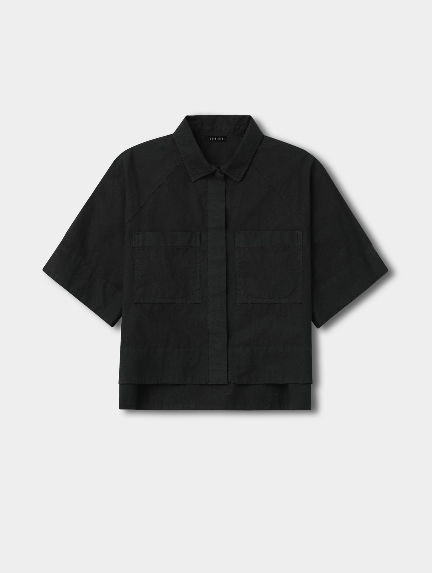 Flat lay view of the Alice Shirt in Onyx Black from AETHER Apparel.
