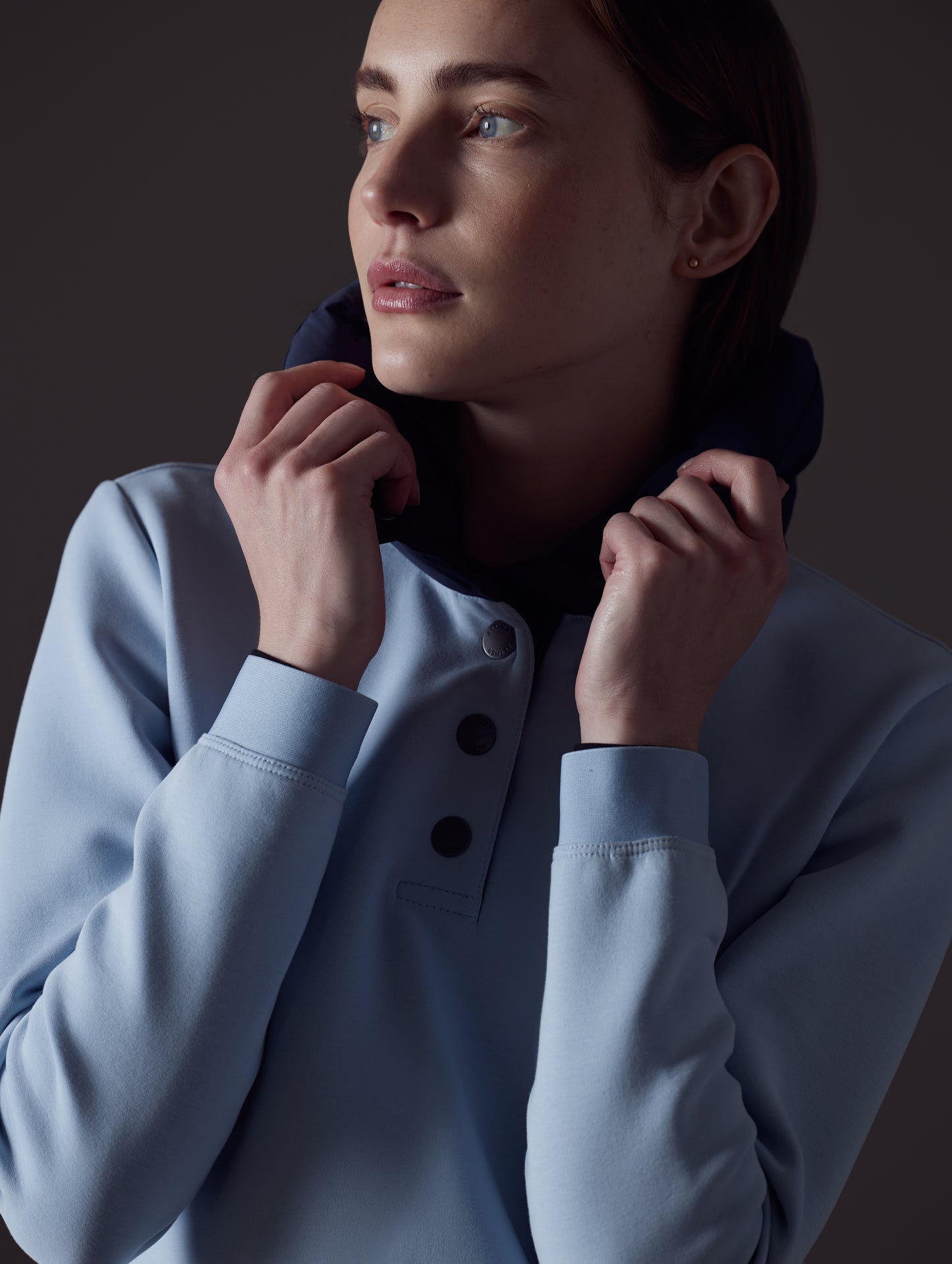 Woman wearing light blue Align Pullover from AETHER Apparel