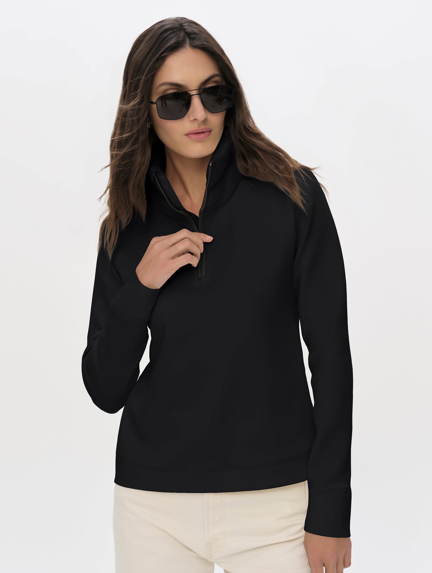 Front upper-body view of woman wearing Align Half-Zip Pullover in Onyx Black from AETHER Apparel.
