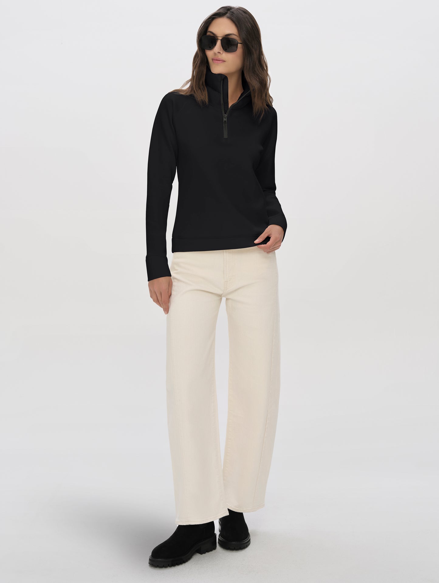 Front full-body view of woman wearing Align Half-Zip Pullover in Onyx Black from AETHER Apparel.