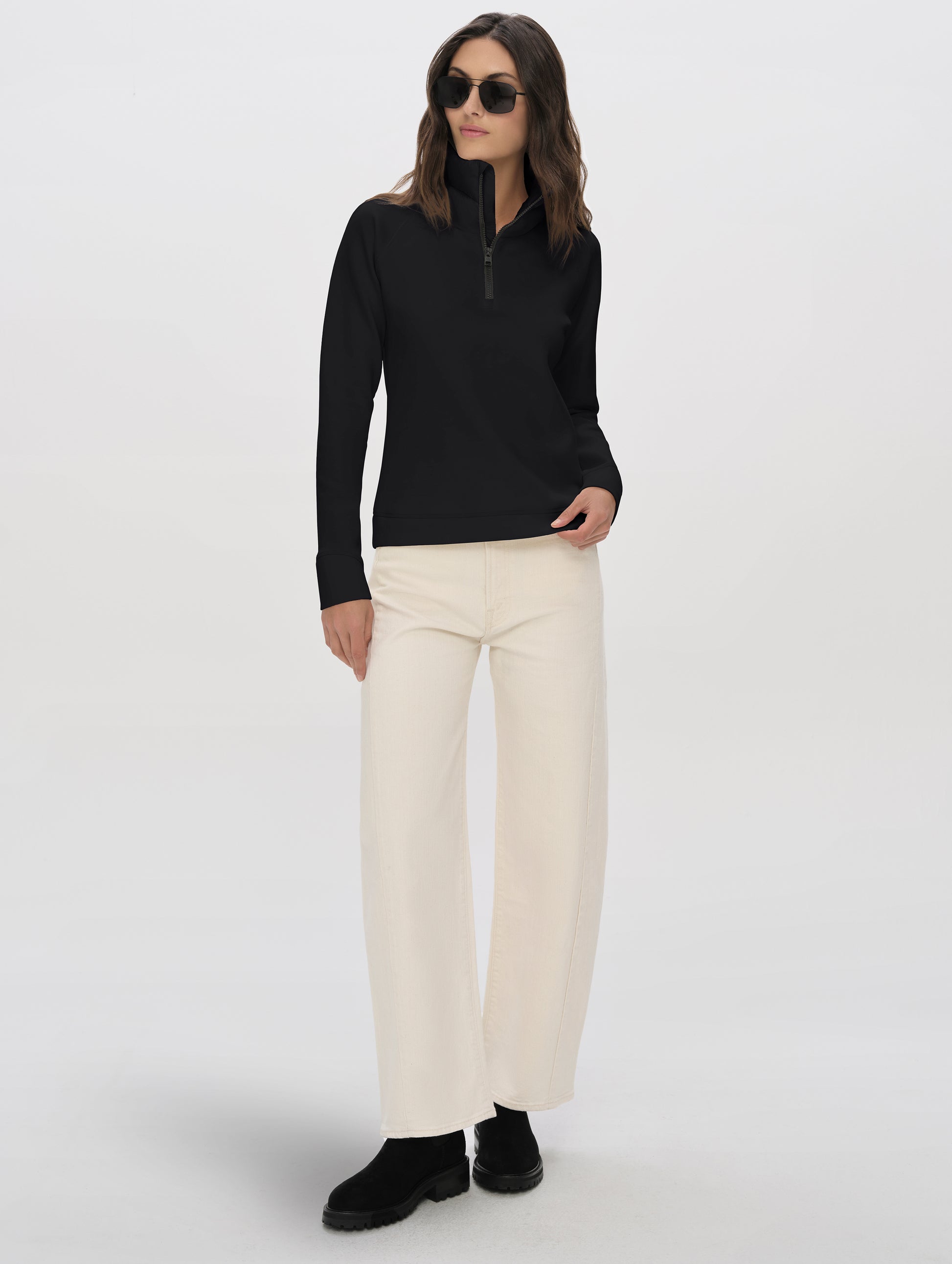 Front full-body view of woman wearing Align Half-Zip Pullover in Onyx Black from AETHER Apparel.