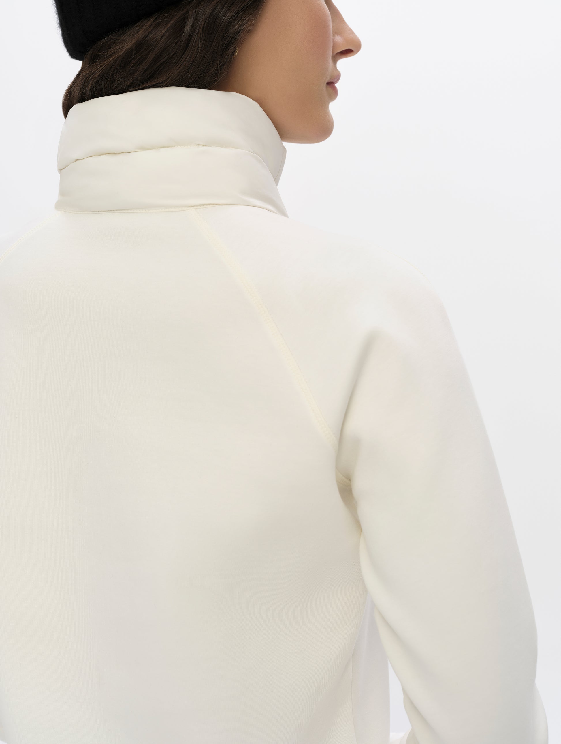 Closeup detaled view of the collar, back, and shoulders of the Align Half-Zip Pullover in Winter White from AETHER Apparel.