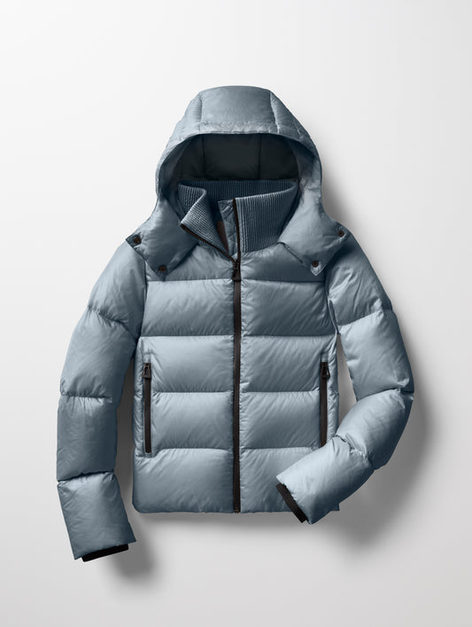 Flat lay of Aura Puffer Jacket in Portal Blue from AETHER Apparel.