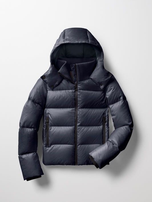 Flat lay of Aura Puffer Jacket in Total Eclipse dark blue from AETHER Apparel.