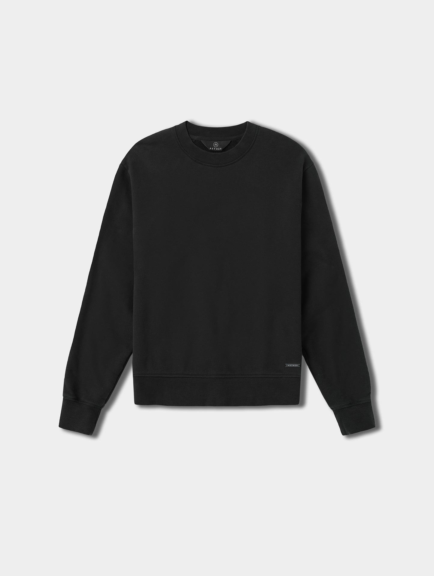 Flat lay view of the Ayla Crewneck Sweatshirt in Onyx Black from AETHER Apparel.